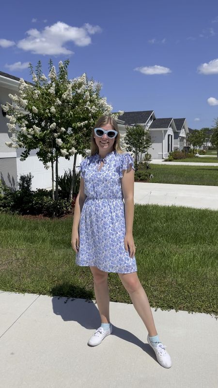 Casual mini dress for summer in a blue floral. I love styling sneakers with a dress in the summer  