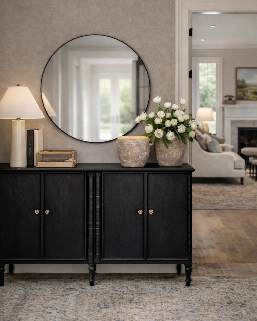 Wayfair Entryway  Follow @farmtotablecreations on Instagram for daily home decor finds and styling inspiration.

This Wayfair black sideboard is the perfect anchor piece for an entryway, dining room, or hallway. I love how the round mirror softens the look and makes the space feel instantly larger, while the simple lamp and neutral accessories keep everything elevated and calm. The ceramic vases with fresh stems add the prettiest organic touch without feeling cluttered. This is such an easy formula for a designer-inspired console setup that works year-round.

#consoledecor #entrywaytable #roundmirror #sideboard #wayfairfinds #homedecorfinds #neutraldecor #entrywayinspo #livingroomdecor #classicinteriors #interiorstyling #homefurniture #decorinspo #lampdecor

#LTKHome #LTKSaleAlert