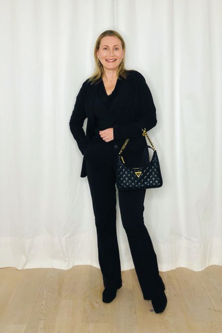 Beautiful black accessories for work:

🖤 Quilted lady-like shoulder bag with chain, model “Giully” by Guess at About You NL 👜
🖤 Water-repellent knitted ankle boot “Regina” GIFTED by Vivaia

#ltkmidsize #ltkover40 #ltkworkwear 
Moderate heel, comfortable heel, knitted boots, elegant shoe, feminine look, chic bag, chain bag, affordable elegance, attainable style, chic for less

#LTKstyletip #LTKitbag #LTKshoecrush