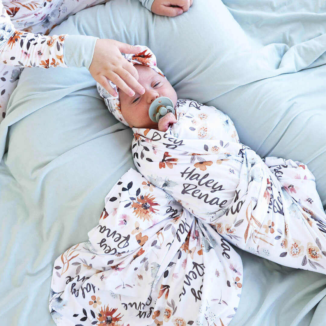 Lorelai's Floral Personalized Baby Name Swaddle Blanket | Caden Lane