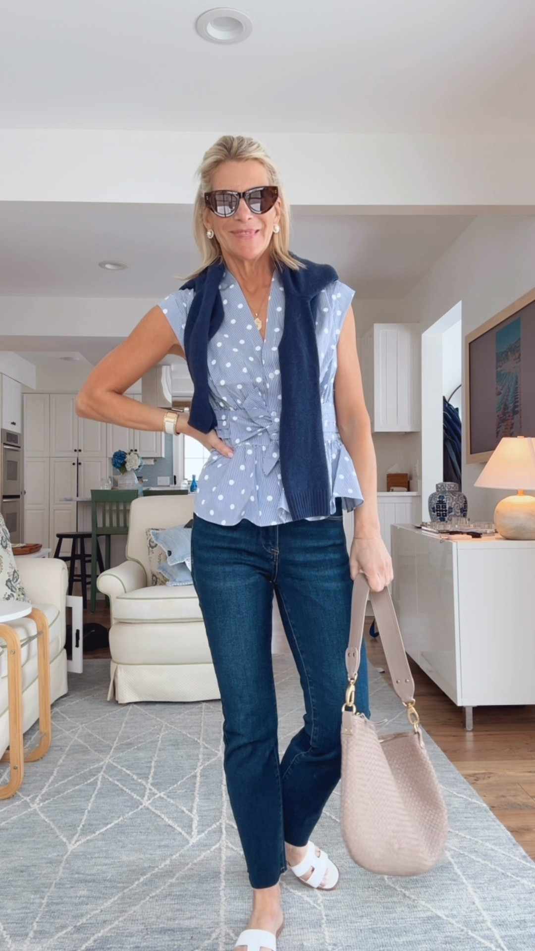How to style a blue and white sleeveless polka dot top for spring. 

#LTKTravel #LTKootd #LTKOver40