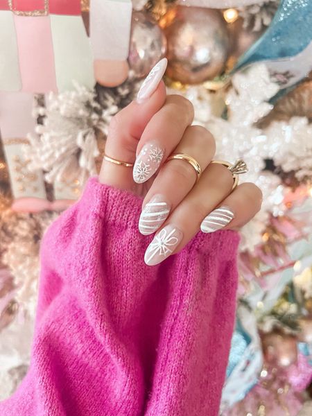 A little Holiday Mani Inspo ✨but keep it neutral✨ So many of you all were asking about this mani from stories…time for a little reveal 💞I wanted Christmas nails that would easily match all holiday looks 🎄I had so much fun creating this look with my nail tech!! 
+ a SURPRISEGIVEAWAY treating 2 of you a $50 PayPal Gift card so you can start off the season with a holiday mani too!! See details in stories 🎉💅 This may be my favorite mani design to date 🎀 What do you think? We used a very lite pink base color and then created the designs with white and silver! Make sure you tag us if you try it out we would love to see😍 #holidaynails #christmasnails #christmas #holidaytime

#LTKHoliday