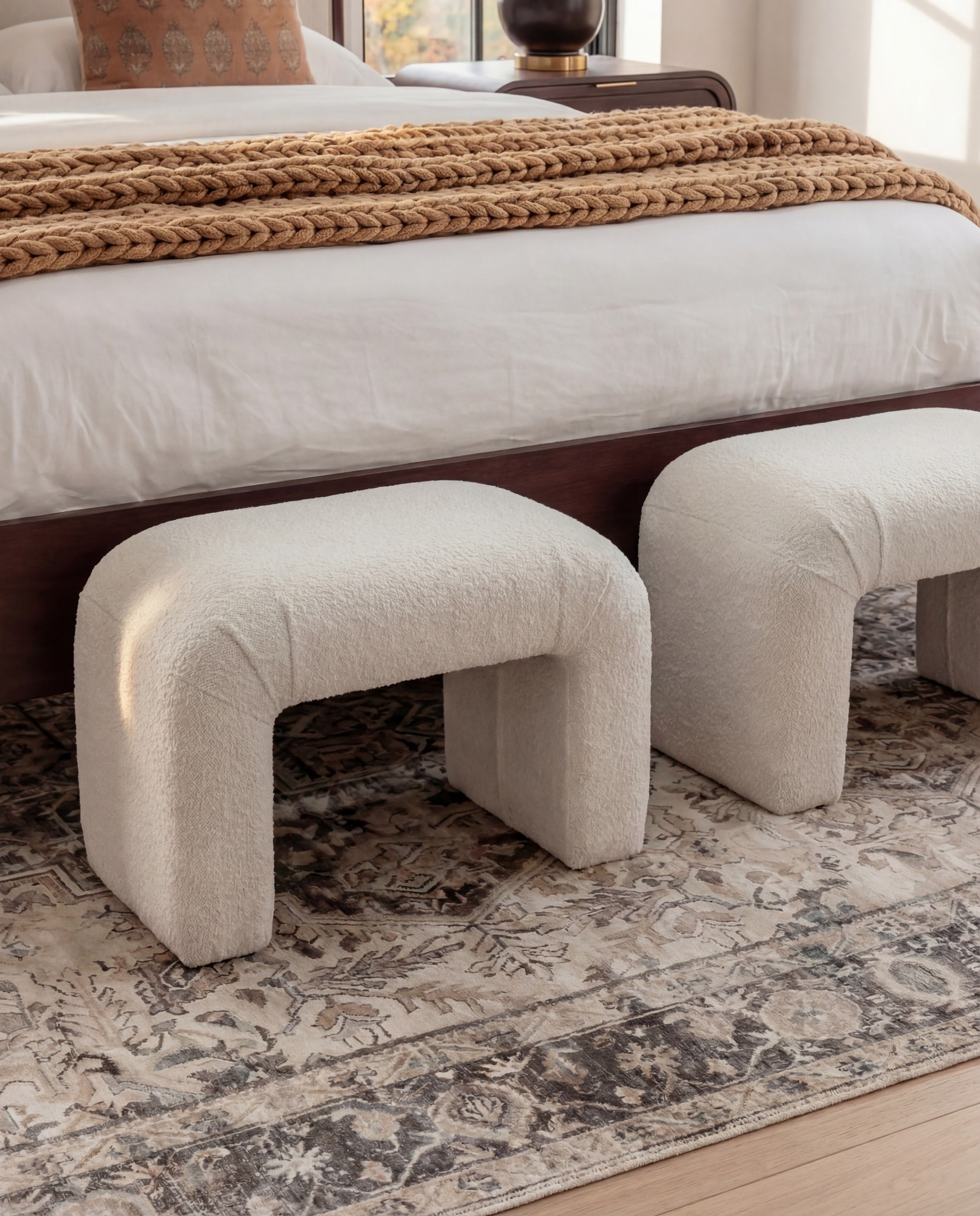 Furniture & Decor
	•	Upholstered wood bed frame (cream fabric)
	•	White bedding set
	•	Chunky knit throw (camel)
	•	Patterned accent pillows (rust/brown)
	•	Wood nightstands
	•	Ceramic table lamps (black base, white shade)
	•	Curved brass-framed wall mirror
	•	Framed floral wall art above bed
	•	Upholstered boucle bench stools (set of two)
	•	Vintage-style area rug (neutral pattern)
	•	Wood dresser with brass corner details
	•	Decorative ceramic vase
	•	Stacked neutral books
	•	Brass decorative tray
	•	Sculptural brass object
	•	Framed artwork above dresser
	•	Exposed wood ceiling beams

#LTKHome #LTKSaleAlert #LTKFindsUnder100