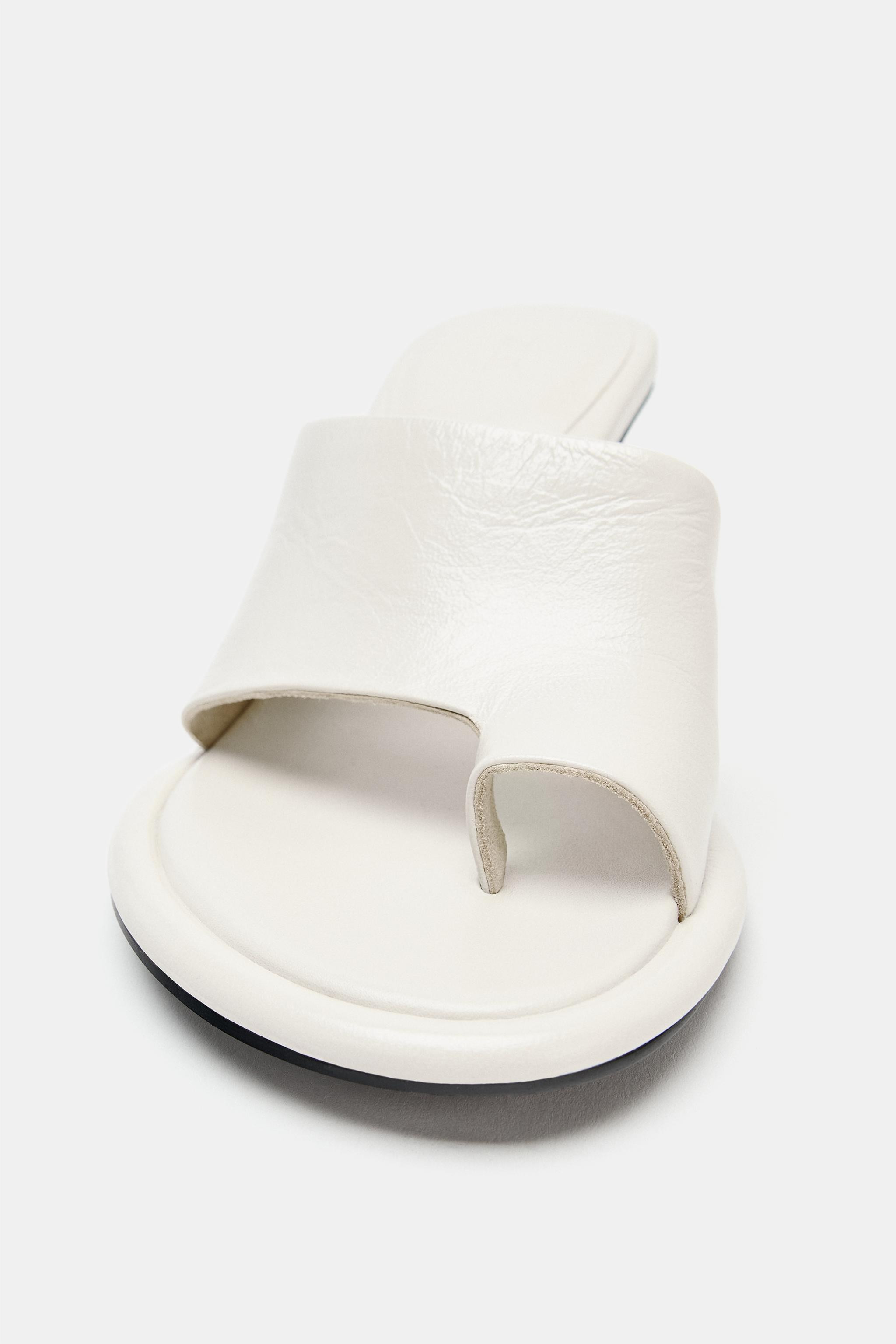 Model height: 178 cmLeather heeled sandals. Mule style. Asymmetric toe post strap at the front. H... | Zara UK