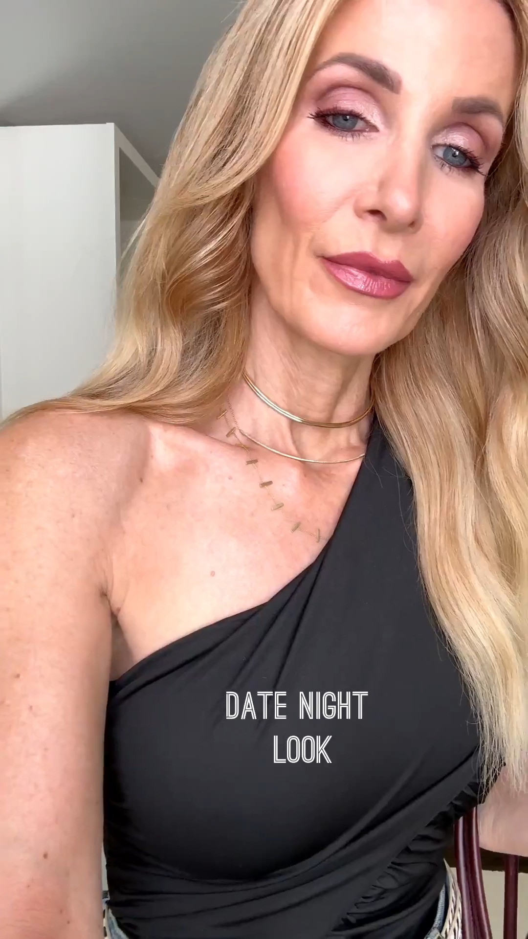 This black one-shoulder bodysuit is fabulous for date night! The flattering ruched detail and open back add a sexy, elevated touch to classic high-waisted jeans. I’m wearing an XS in the bodysuit and a 24 in the jeans. #DateNightOutfit #OneShoulderTop #BodysuitStyle #JeansOver40 #WomenOver40Style 

 
