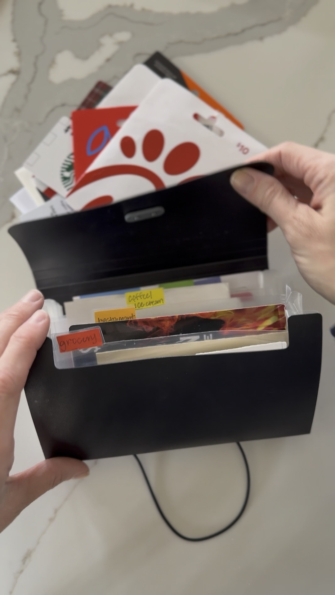 Here’s how I store my gift cards and coupons! This way they are all in one spot and organized by category! So easy to grab on my way out the door, toss in my bag or keep in my car console! I keep my grocery coupons in here too! 

#LTKHome #LTKFamily #LTKWatchNow