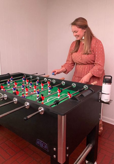 If you’re into a “big gift” this is a great one! It’s high quality, durable, and fun! There are inclines in the corners to keep the ball in play. There are two different styles of players to choose from. The cup holders on each end are a nice touch! Santa also brought us colorful soccer balls for a little extra fun!

#LTKfamily #LTKGiftGuide #LTKhome