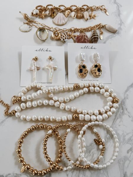 ettika jewelry, summer jewelry, beachy charm bracelet and necklace. Shell charm necklace 
Pearl cross earrings 

#LTKStyleTip #LTKSeasonal