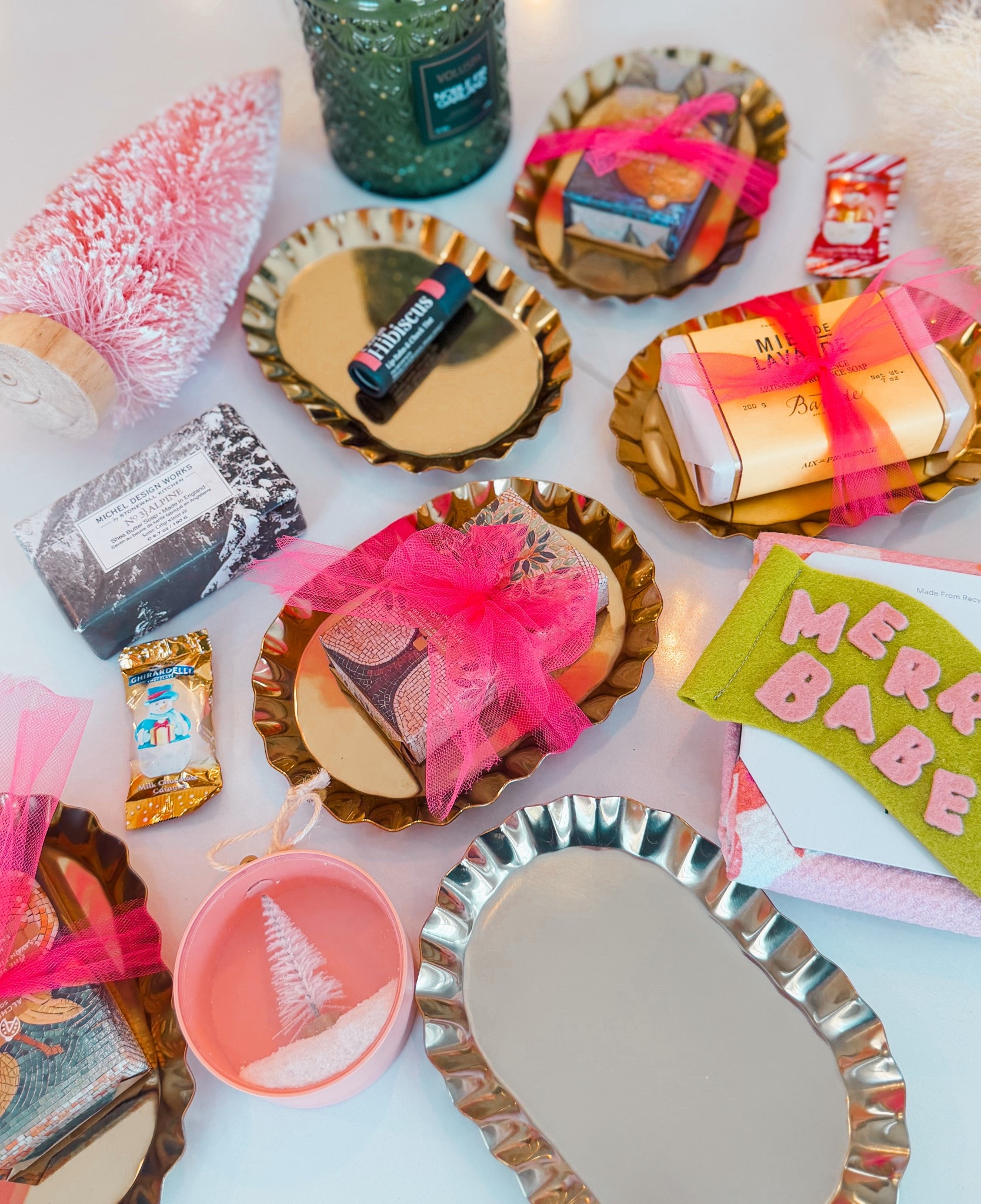 It’s the time for giving. 🫶🏽

I always get asked what I’m giving, and I found the cutest trinket trays at Target for only $5. They come in gold or silver. I topped them with cute bar soap that I picked up at TJ Maxx, making this gift under $10.

You could add your favorite @rootandbloomcompany tinted lip, or a @geometry.house towel, or anything else on top. The tray itself is adorable to hold jewelry next to your bed, or to set a candle on. 

Items linked here!

#LTKHoliday #LTKHome #LTKGiftGuide