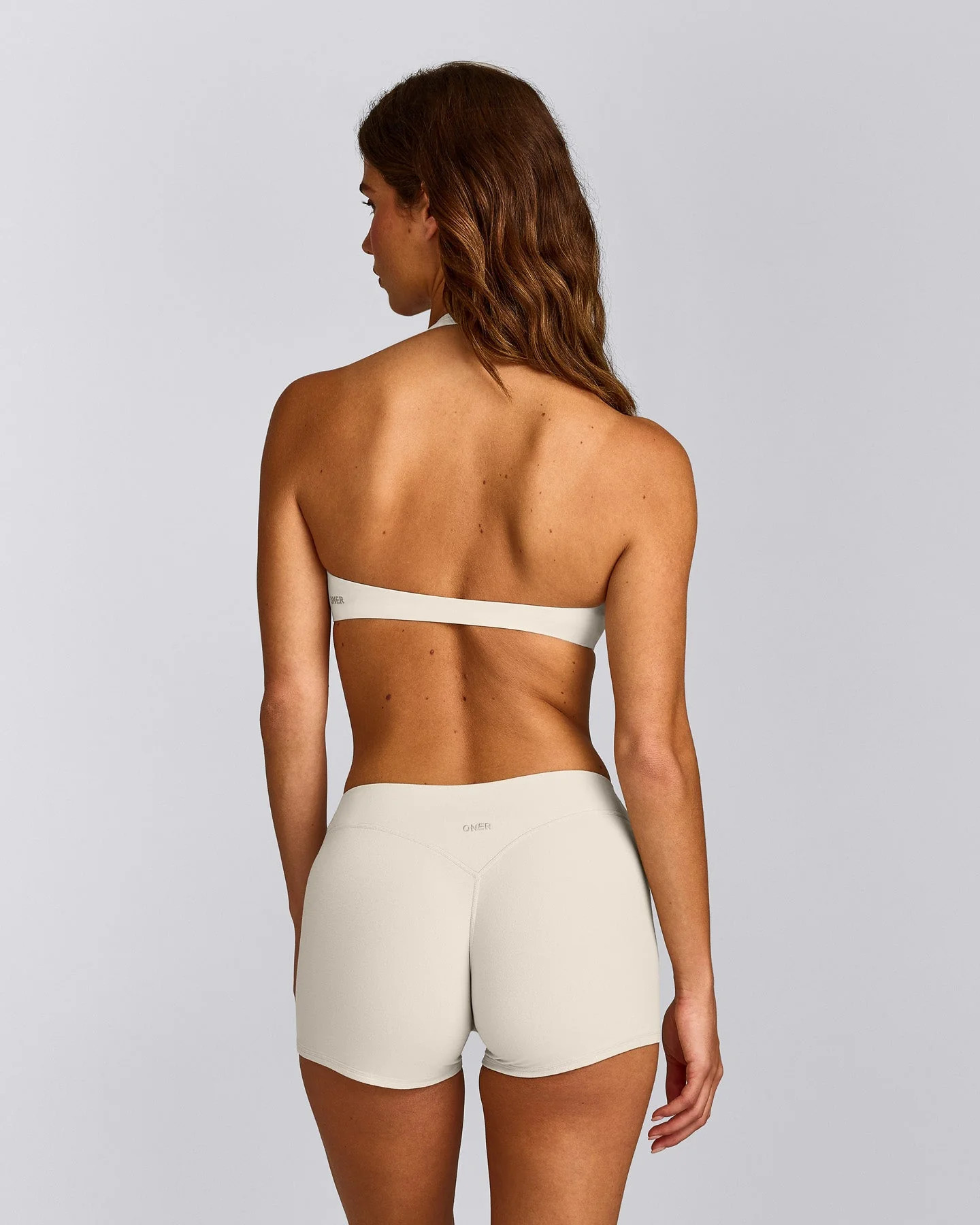 SoftMotion\u2122 Minimal Halter Neck Bralette with Gray Logo 
 Marshmallow White | Oner Active (UK / US)
