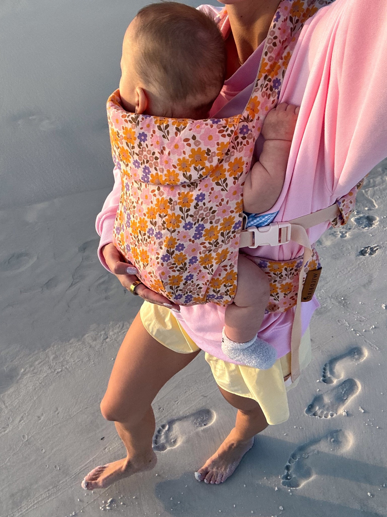 Beach walks with my baby 🤍🌸

Wearing my comfy pink “mother” crewneck from The Beach Club, flowy Aerie shorts, and this floral Wildbird carrier—perfect for keeping baby close while still feeling cute + hands-free ✨

Easy, breezy, and made for slow summer days by the water 🌊

#LTKstorytime #LTKBaby #LTKmomlife