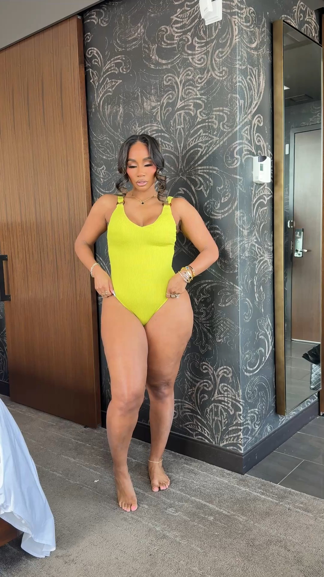 Under $30 one piece swimsuit find with gold metal detailing  