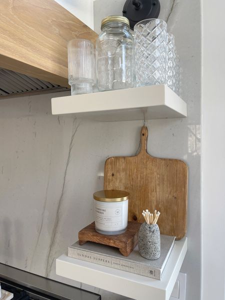 HOME \ kitchen shelf styling! New decor items: candle, rustic tray and stone match holder.

Glasses
Amazon
Non-toxic candle 

#LTKhome #LTKfindsunder50