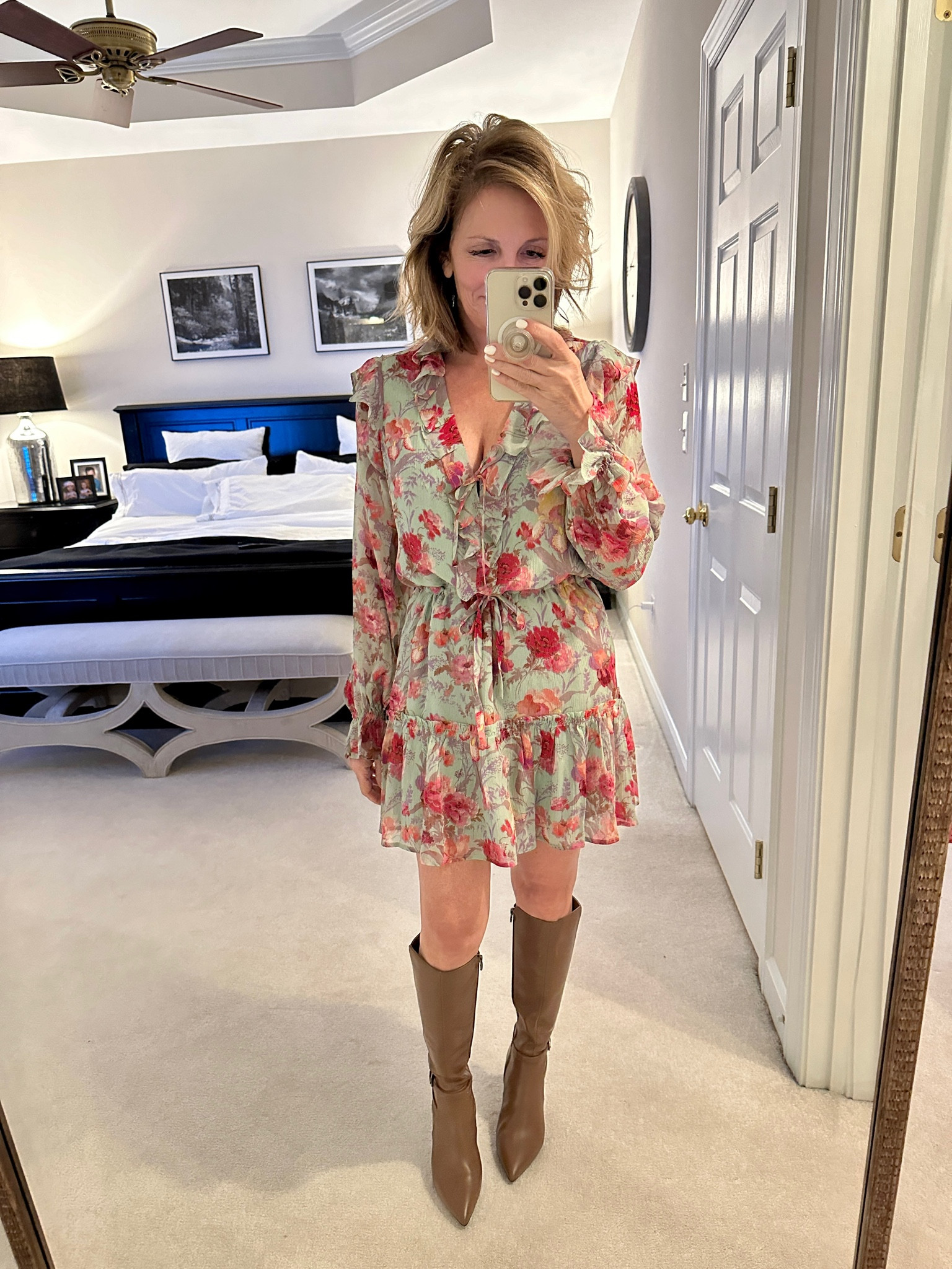 Stiletto brown boots paired with a lightweight ruffled dress for a perfect date night fit