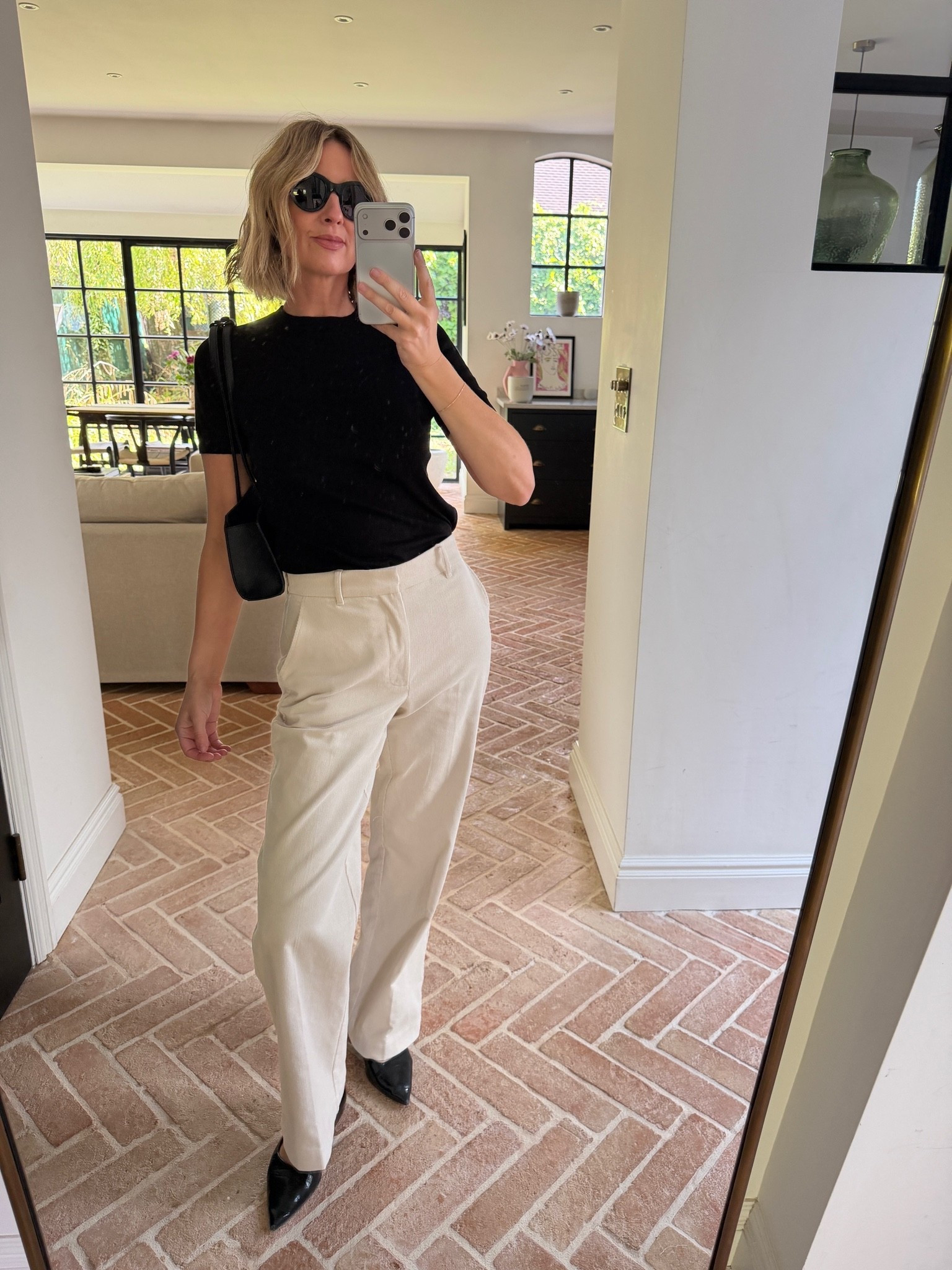 Simple but chic 🤍

black crew neck t shirt, cream corduroy trousers, tailored wide leg trousers, black patent pointed toe flats, black crossbody bag, gold bracelet, black round sunglasses, casual chic outfit, office to weekend style, autumn transitional dressing, elevated basics, quiet luxury, neutral color palette, monochrome styling, mirror selfie ootd, ltkstyletip, ltkseasonal, ltkfindsunder100, ltkworkwear, ltkitbag

#LTKFashionMonth #LTKautumn #LTKdatenight