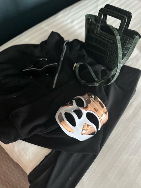 Overnight travel essentials:
This mask to wake my face up!
Sunglasses to hide tired eyes 
My favorite sweatshirt that looks chic but is under $30