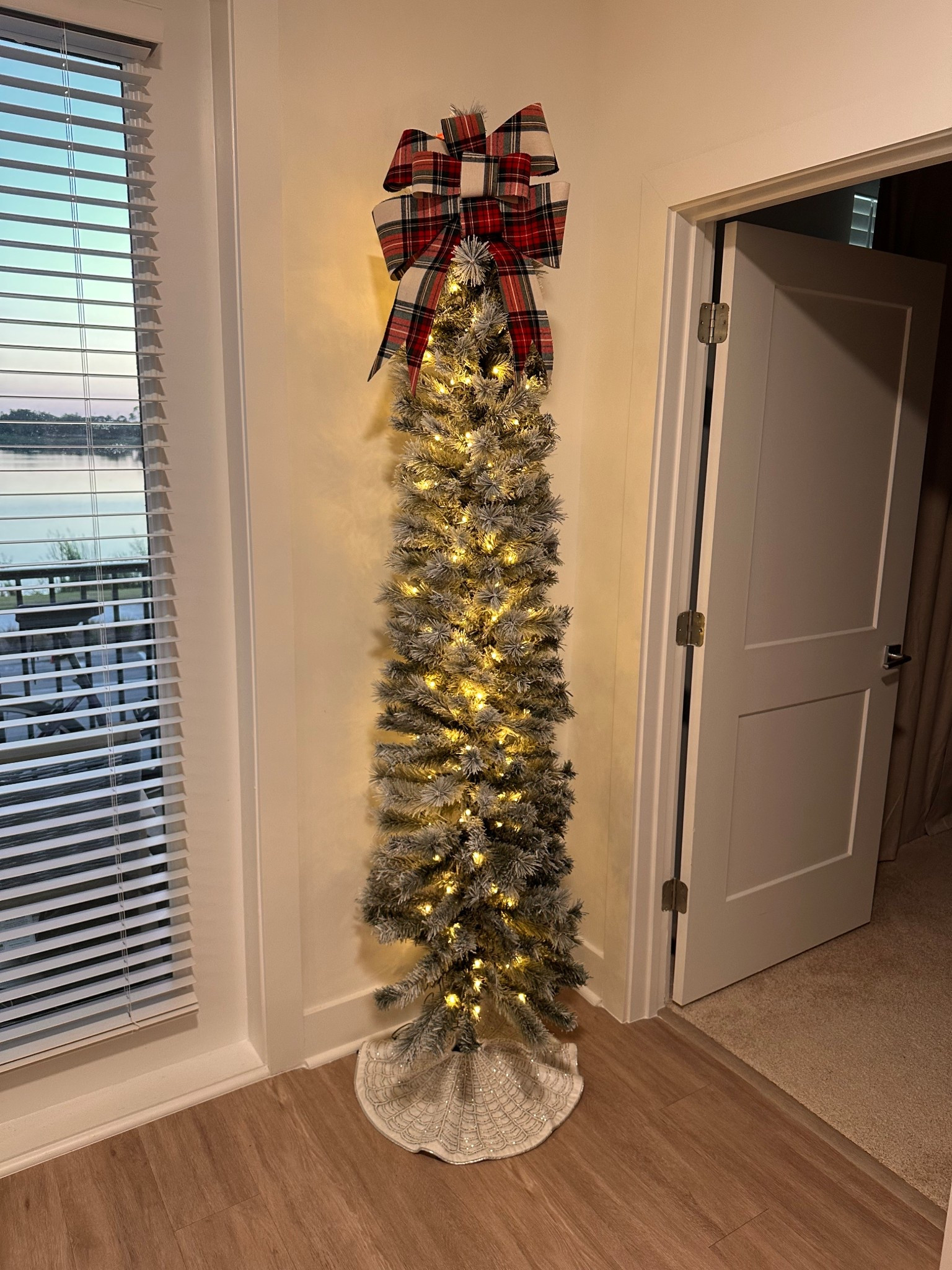 Perfect flocked pre lit skinny Christmas tree ❤️💚

#LTKHoliday #LTKHome #LTKFindsUnder100