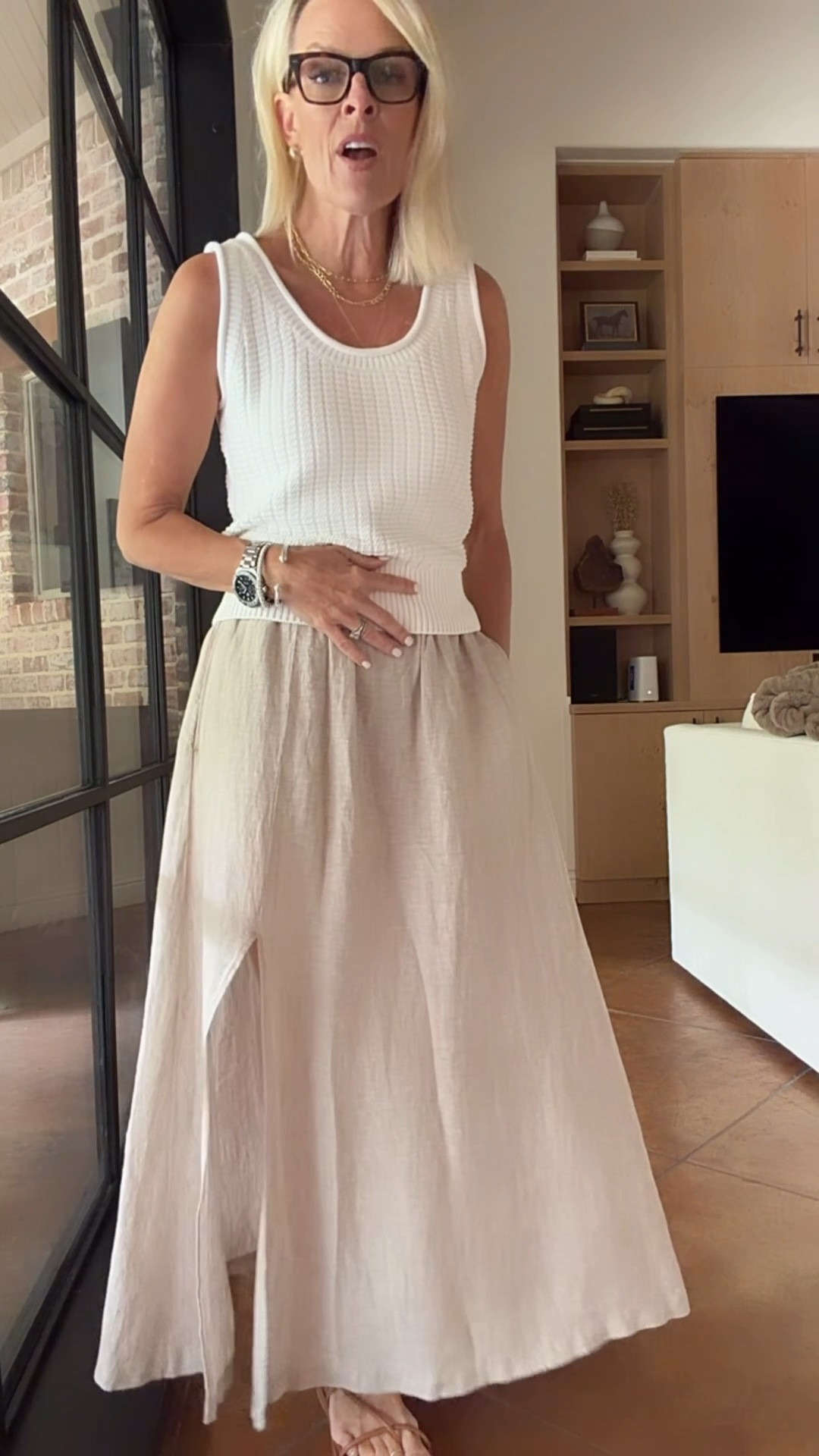 This skirt is back in stock!! 
Fit is tts love this color flax. Elastic waist band. Goes with so much 
And the sweater tank comes in a few colors. I’m wearing medium 

@Quince #quincepartner

#LTKdayinmylife #LTKootd #LTKOver40