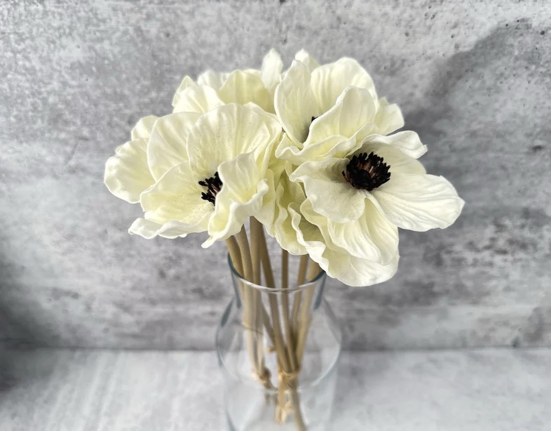 Real-touch silk that truly fools the eye 🌸 These white anemone stems look and feel incredibly lifelike, capturing all the delicate details of real anemones without the maintenance. A top trending flower for weddings, bouquets, and event décor, these faux blooms are perfect for styling vases, centerpieces, or flat lays year-round. Each set includes 3 stems with 3-inch flower heads and a 14-inch length for effortless arranging.

#LTKhome #LTKdecor #LTKwedding #fauxflowers #anemones #homedecor #eventdecor #weddinginspo #realisticflowers #silkflowers

#LTKHome #LTKWedding #LTKSeasonal