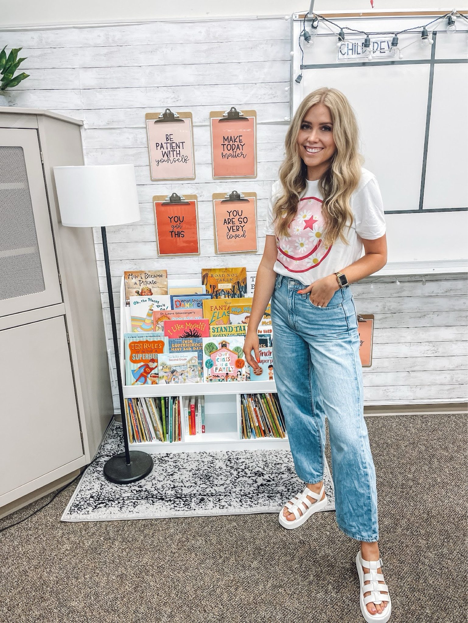 fav little cute corner of the classroom! bookshelf for holding the children’s book I read to my child development class! 
clipboards are holding quote posters available in my TPT store!

smile tee: wearing men’s small 
jeans: true to size
Sandals: true to size 

| classroom | classroom decor | classroom organization | middle school teacher | teacher outfit | amazon 

#LTKWorkwear #LTKFindsUnder50 #LTKFindsUnder100