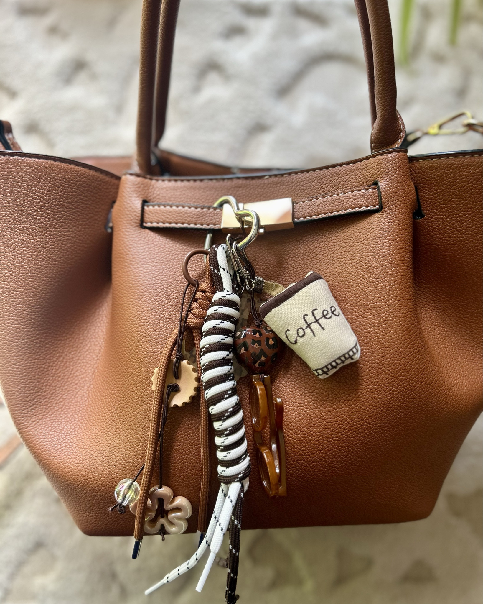 My go To fall bag and I recently grabbed the cutest clip on charm giving major designer inspired vibes!! 

#LTKSeasonal #LTKItBag #LTKGiftGuide