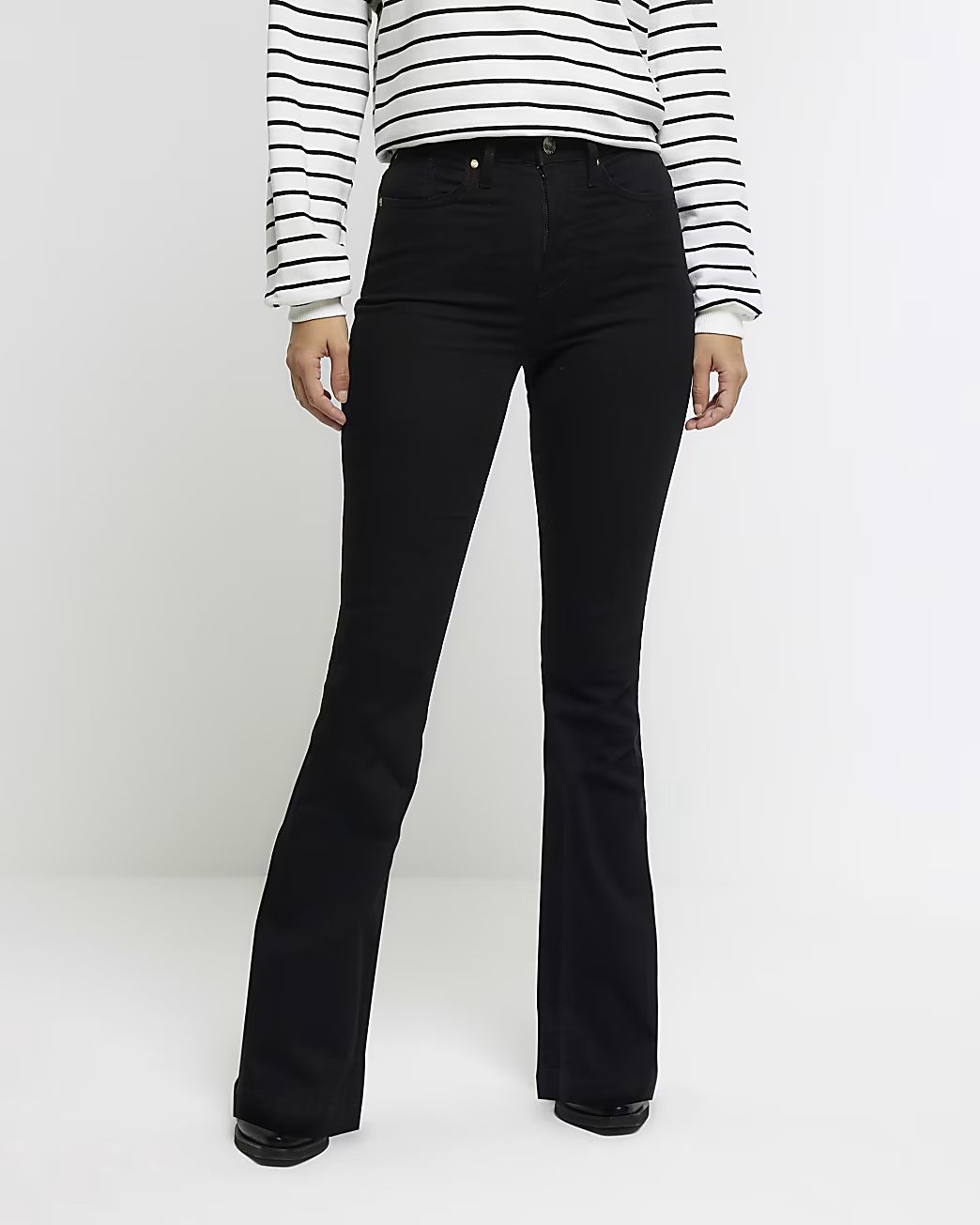 Black mid rise flare jeans | River Island (UK & IE)