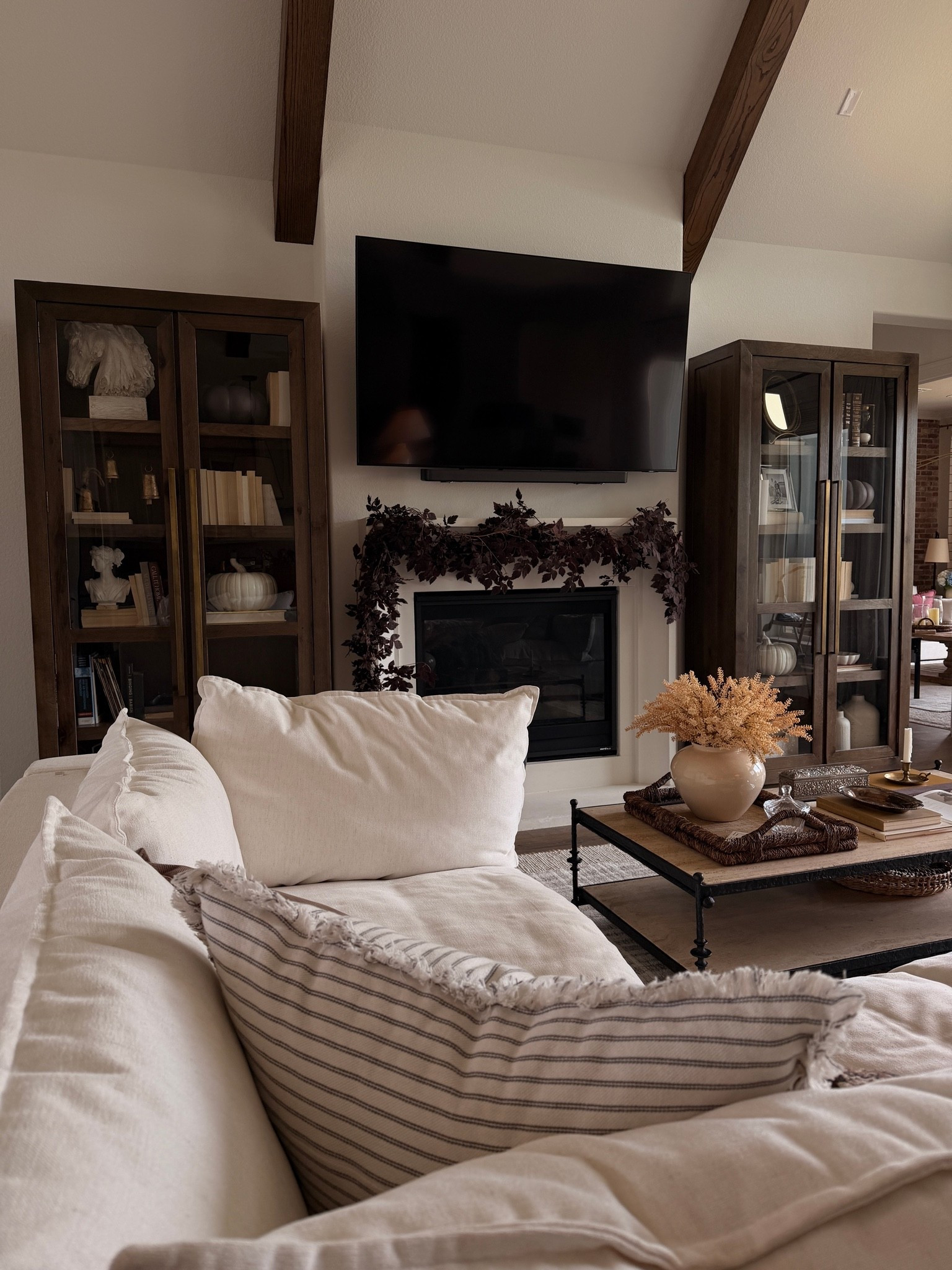 Cozy living room, sectional, home decor, cozy home, coffee table, tall cabinets, garland, fall decor

#LTKdayinmylife #LTKHome