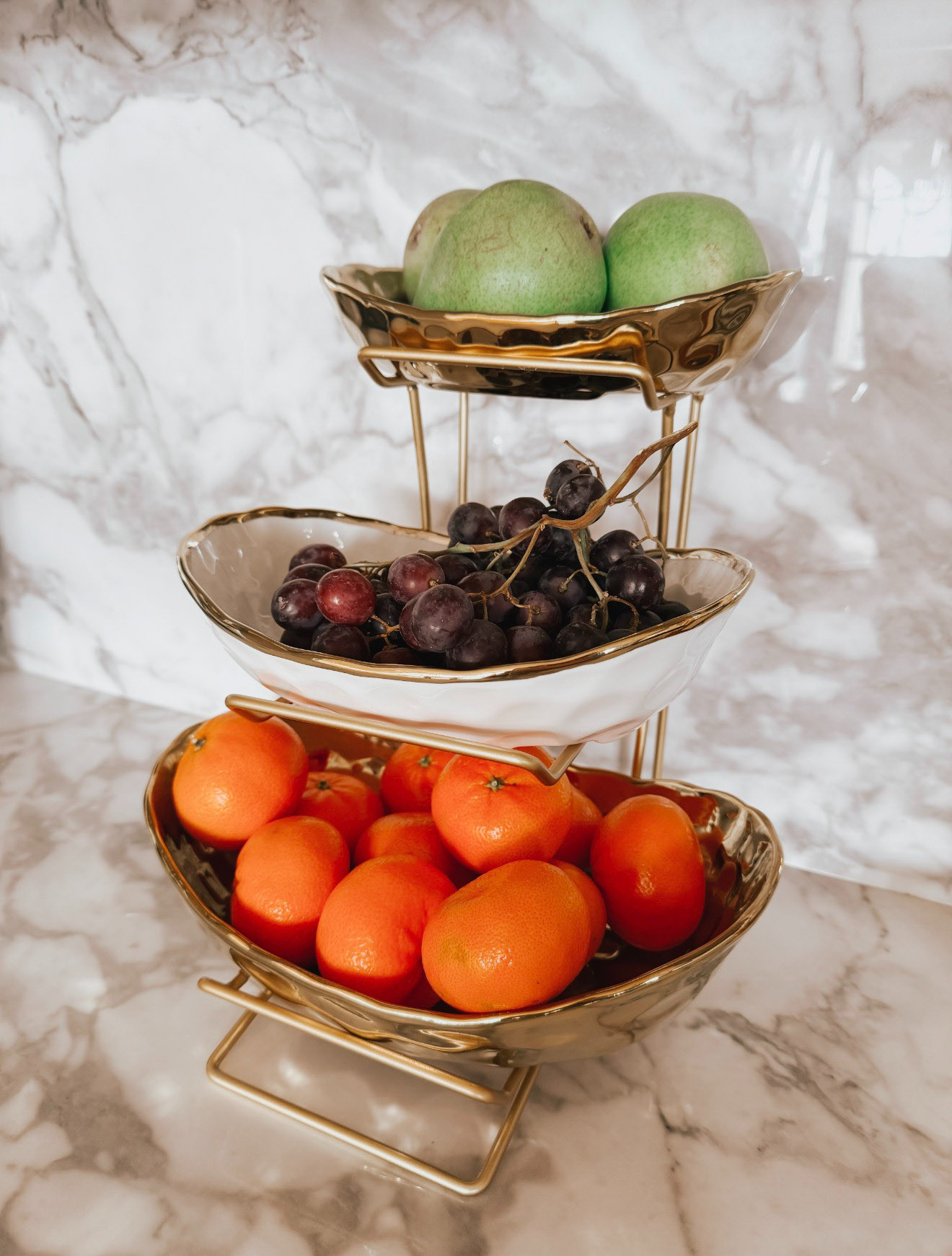 This 3-tier white + gold ceramic fruit stand for the kitchen counter is a decorative and functional organizer designed to store and display fruits, snacks, or small items vertically. Saving counter space while adding a polished look to your kitchen. 

 #LTKmomlife #LTKfoodie #LTKHome