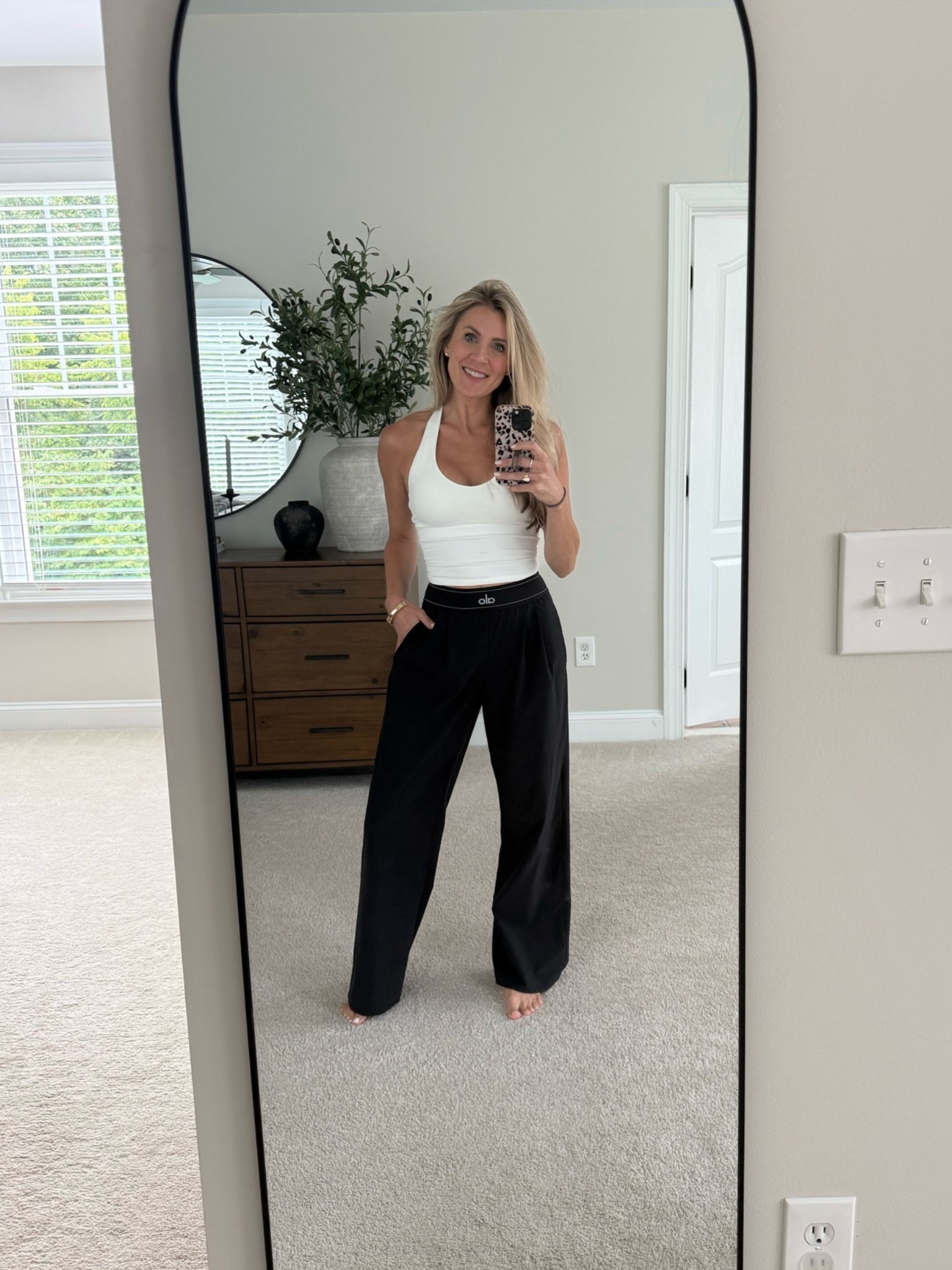 The Alo pants I wear every other day 💁🏼‍♀️😂 Lightweight, SO comfortable, and perfect for transitioning into fall. Paired with this white halter top with a built-in bra for the easiest everyday look.

#LTKmomlife #LTKActive #LTKdayinmylife