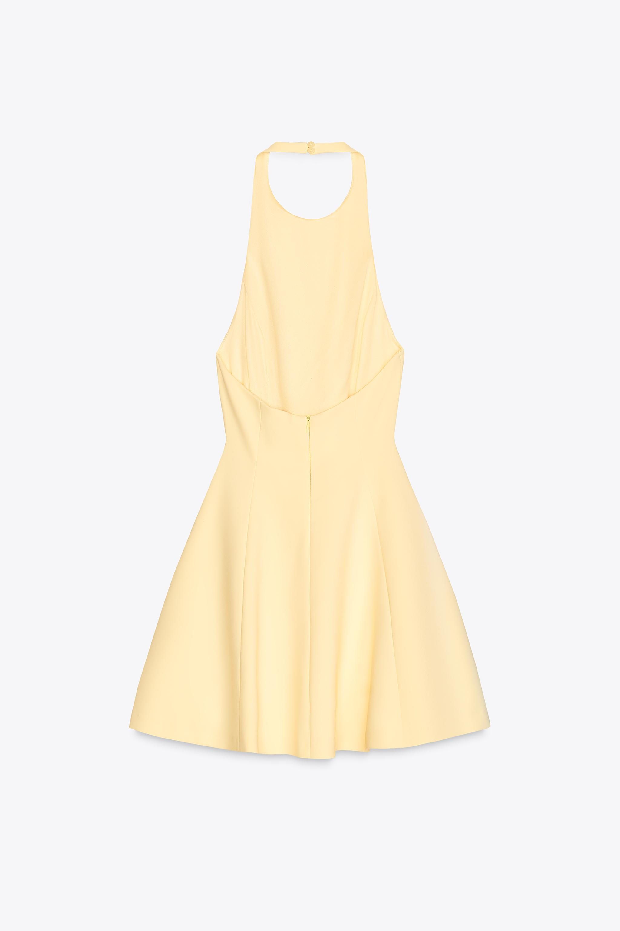 Short halter neck dress. Open back. Hidden in-seam side pockets. Matching inner lining. Back clos... | Zara US