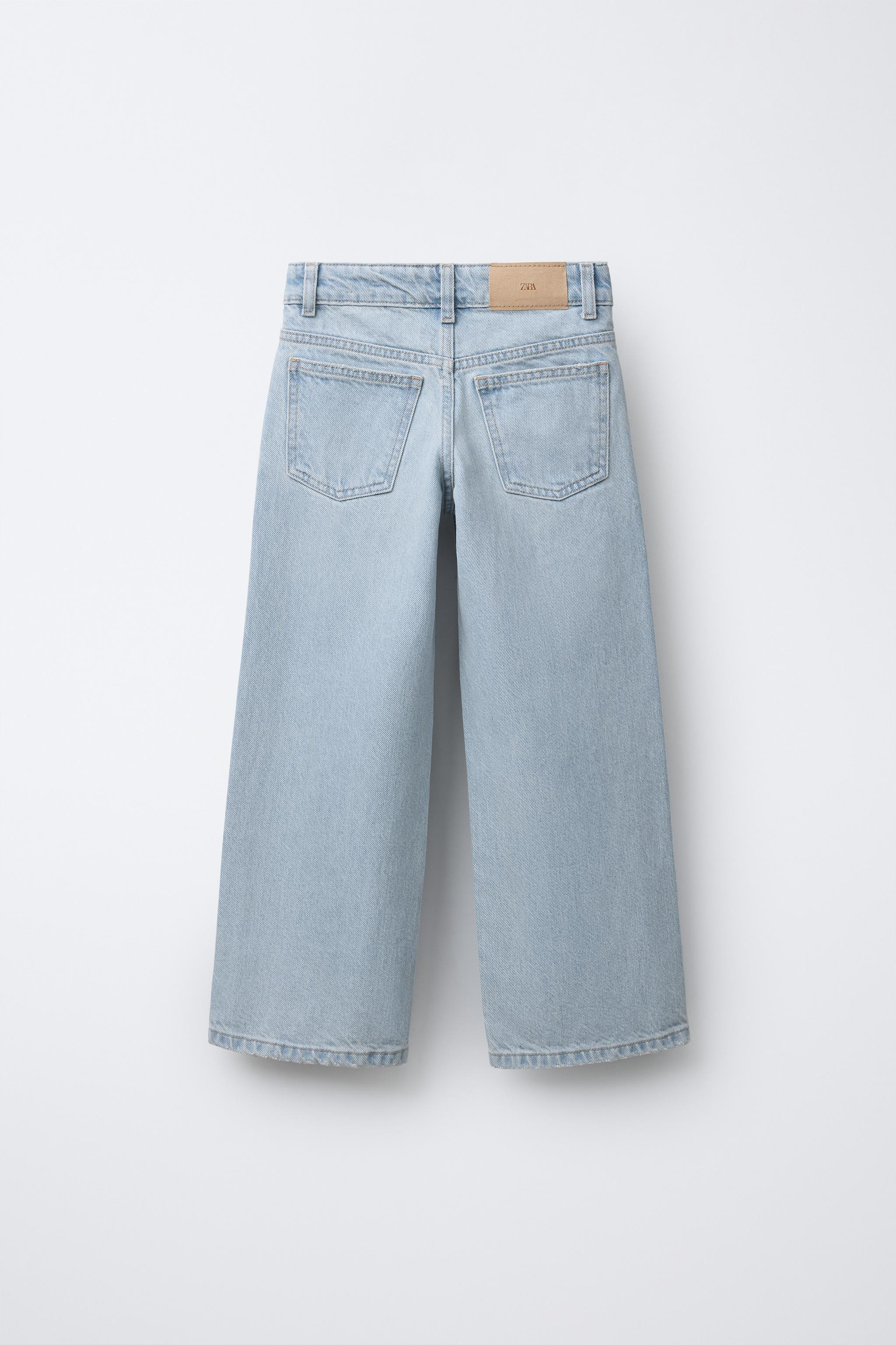Wide leg jeans with an adjustable inner waistband and front button closure. Front pockets and pat... | Zara US