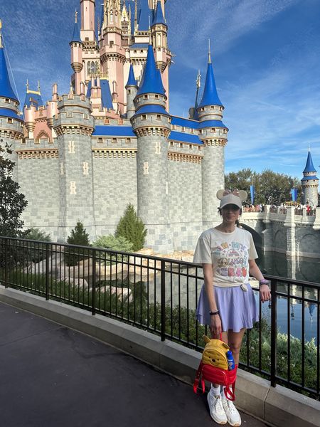 Disney world outfit 
Lululemon skirt
In my Disney era tee
Winnie the Pooh loungefly backpack 
Minnie ears baseball cap