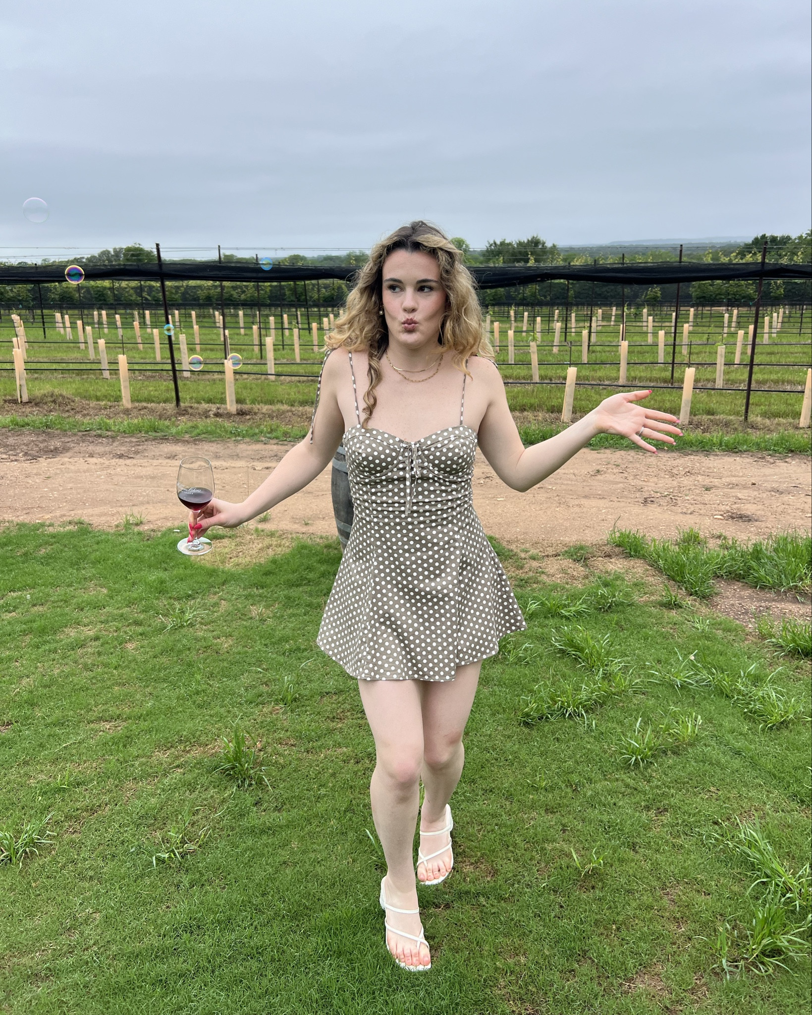 One of my favorite girly dresses of all time paired with my favorite purse of all time. I wore it In Fredericksburg for a wine tour but you could also style it for a date night or even for a country concert outfit.

#LTKItBag #LTKFindsUnder100 #LTKStyleTip