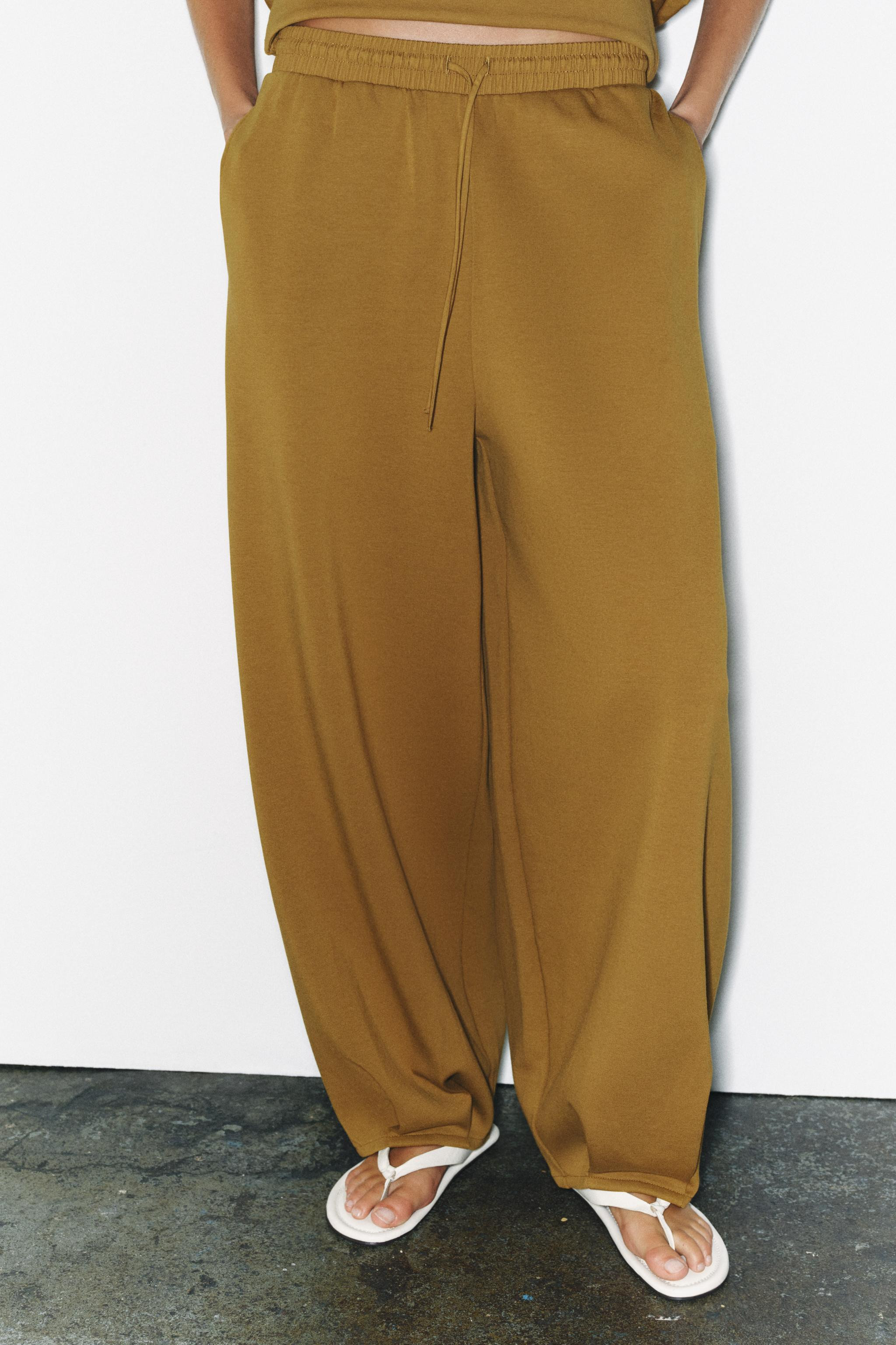 Trousers made from a cotton blend. Mid-rise with an elastic waistband. Hidden side seam pockets. ... | Zara US