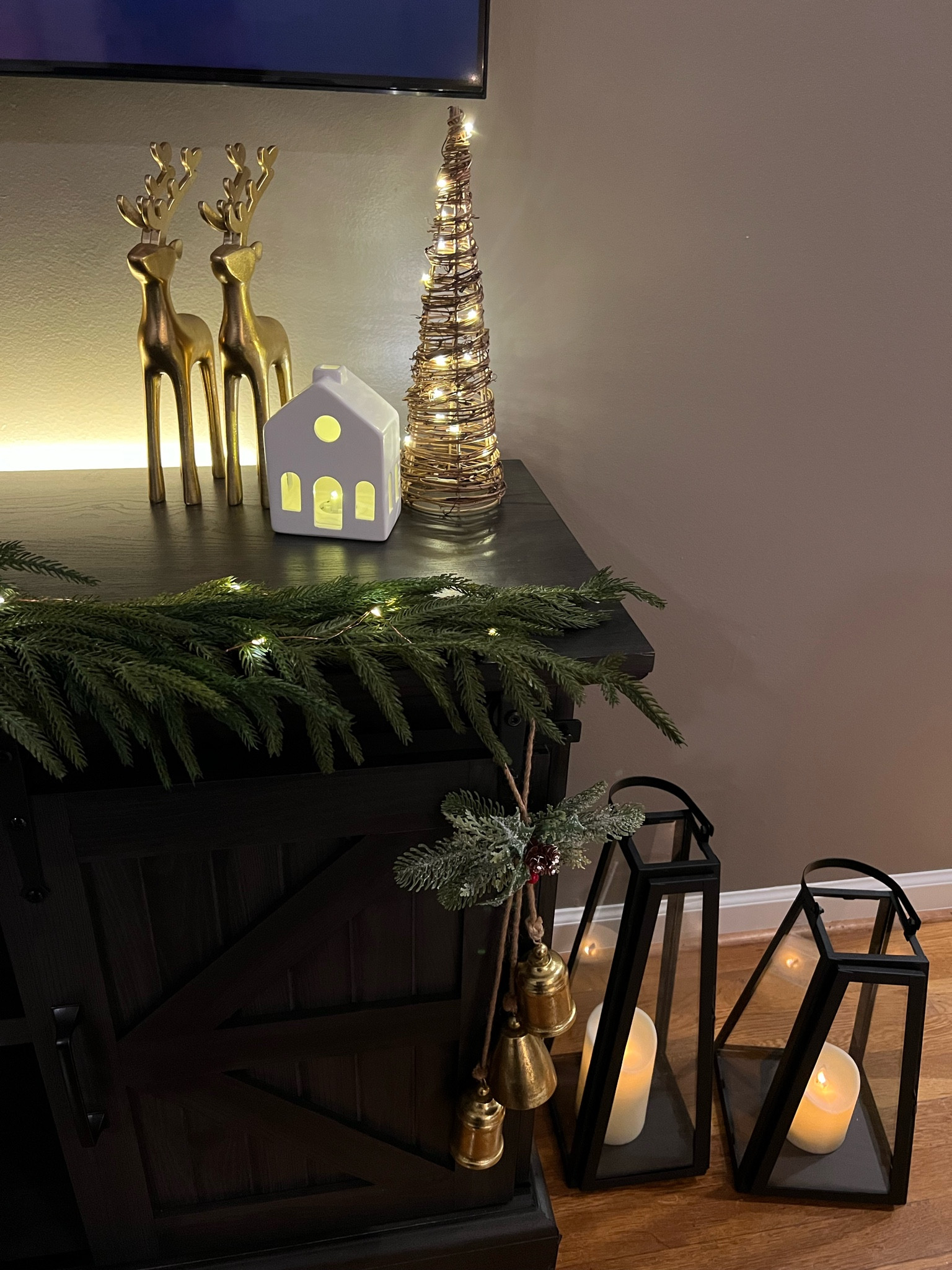 Tv stand Christmas decor 🎄

Realistic garland, gold reindeer, mantel bells, floor lanterns, Norfolk garland, mantel decor, neutral Christmas decor

#LTKhome #LTKHoliday #LTKSeasonal