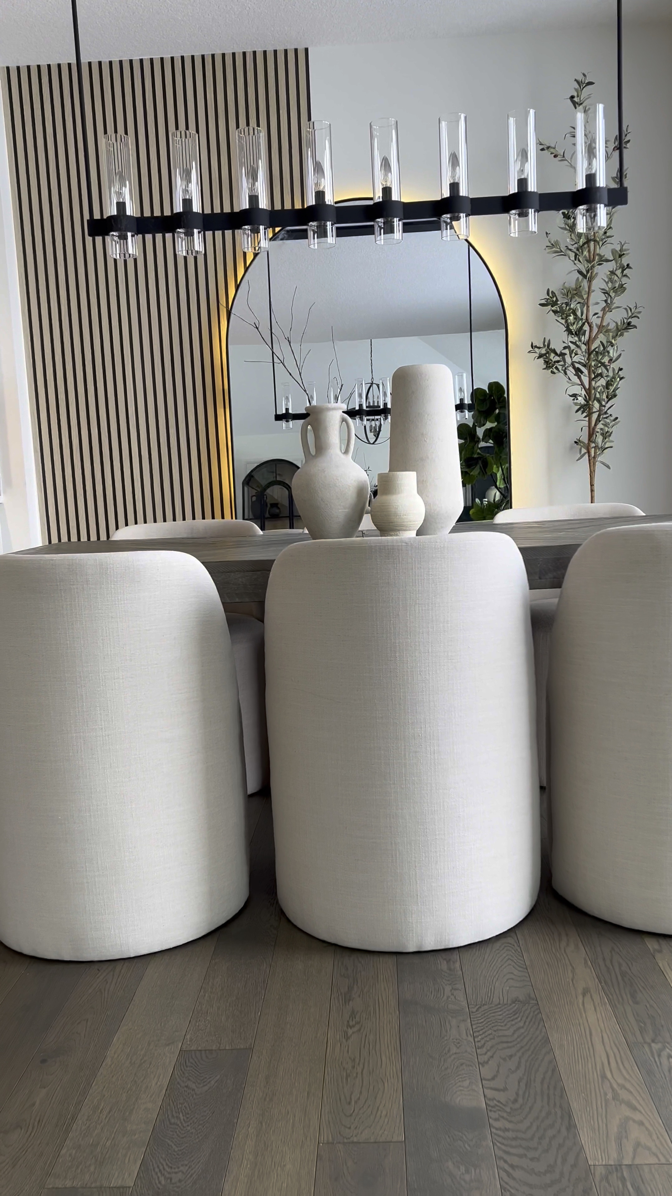 Hey friend! ☺️
So here’s a simple way to upgrade your wall and get the wooden slat look with wallpaper! 🎉

Tips: 
Wallpaper is peel and stick so to remove, use a blow dryer so you don’t mess up your paint or drywall ☺️ I used 3 rolls. My wall is 9ft by 10.5ft 

This is by far the simplest wallpaper I’ve installed. The design is forgiving, so even if you overlap a bit more than you’d like, it isn’t noticeable… making install even simpler. 

I added plug in 16 ft LED light strips to the back of the mirror. Color is warm white or 3000K. 

The sconces are my favorite addition to this wall! They are rechargeable. 🎉 They attach to the wall in two ways - They come with screws & a peel and stick adhesive….. which attaches to a magnetic metal piece which makes the sconce removable without having to reinstall it. 💕

I’ve linked the rest of the items below! ☺️

#LTKVideo #LTKstyletip #LTKhome