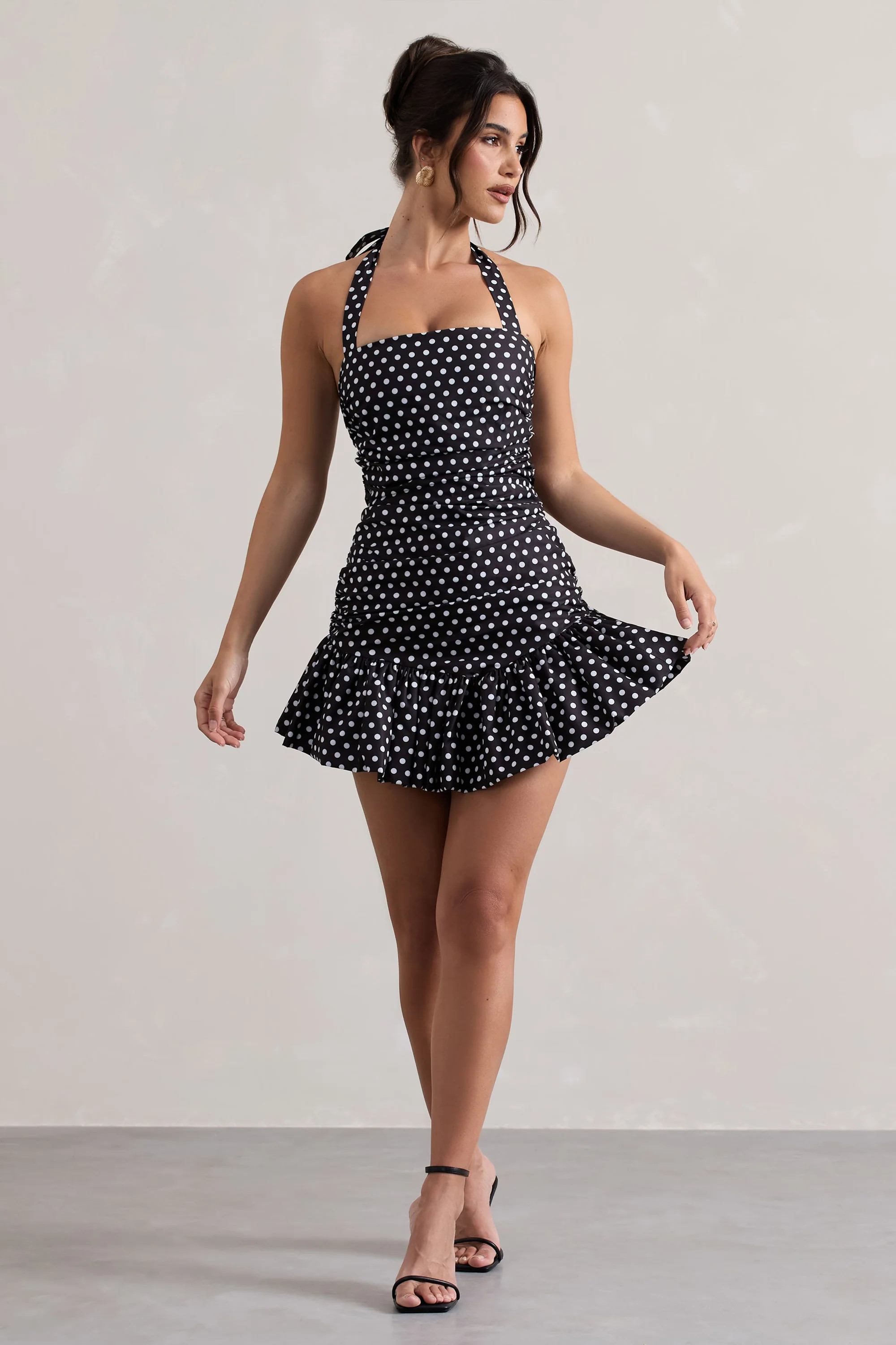 Zahra | Black & White Polka Dot Halter-Neck Ruched Mini Dress With Ruffle Hem | Club L London
