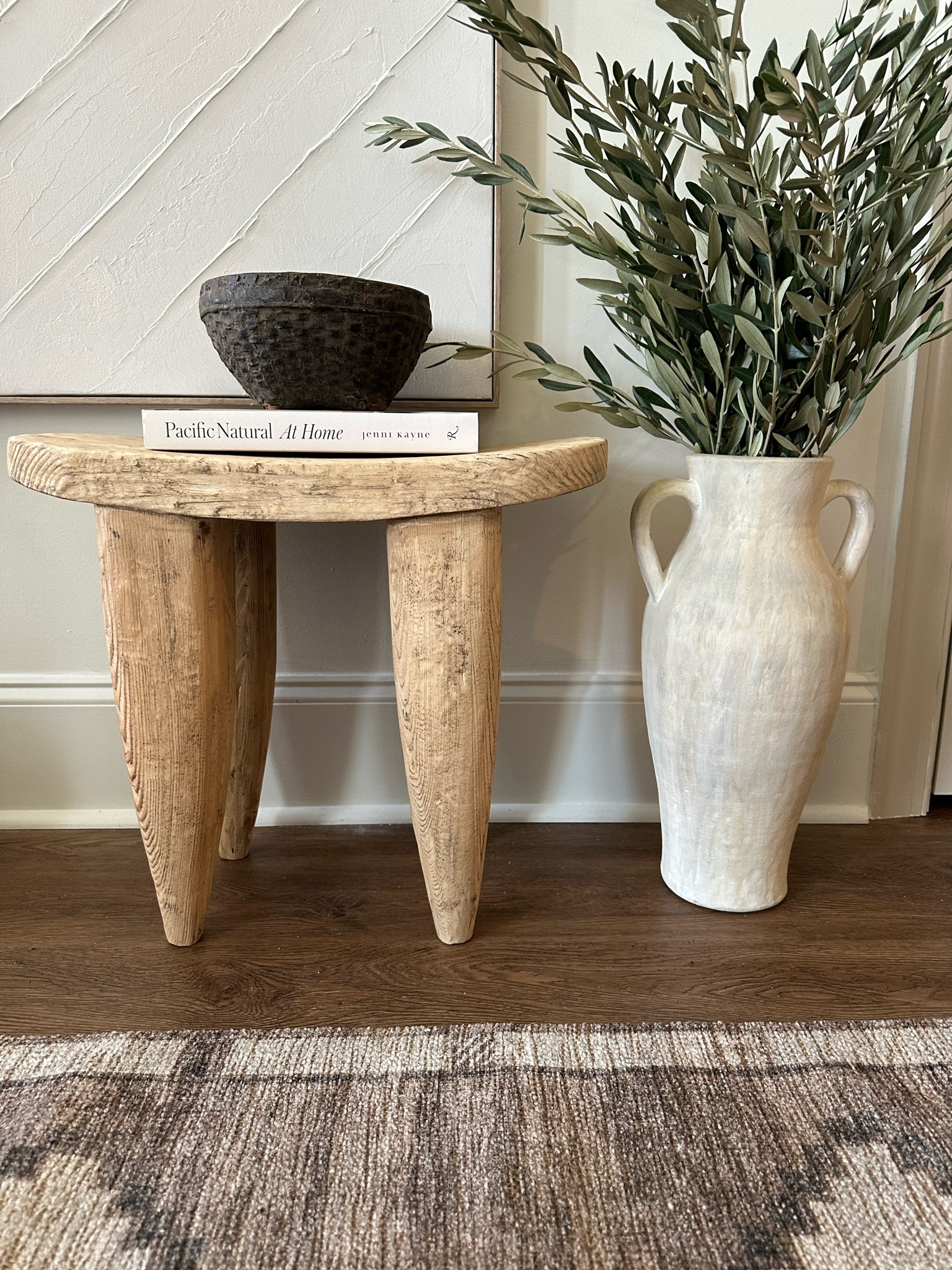 Beautiful Senufo stool & olive stems
#senufostool #stools #stool #olivestems #olivebranches #entrywaydecor #organicentryway #rug #runner #organicmodernhomedecor 

#LTKSeasonal #LTKhome