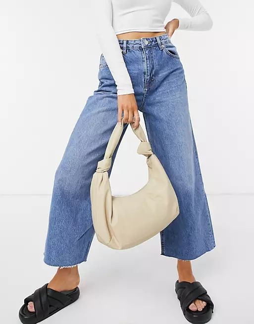 Monki Mayo slouchy faux leather knot bag in beige | ASOS (Global)