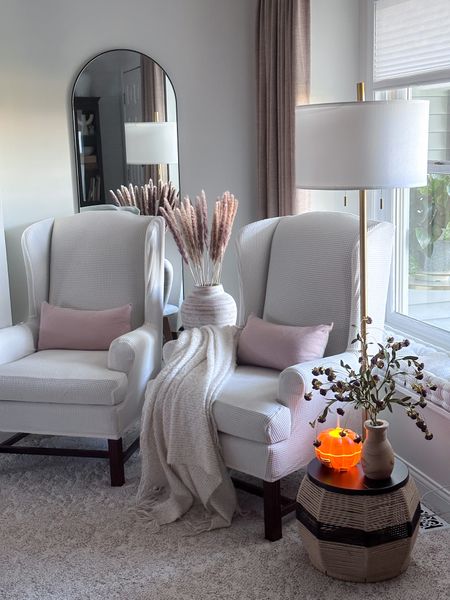 Cozy corner sources 
Wing back chair covers
Floor lamp
Pumpkin diffuser 
Arched floor mirror 

#LTKhome #LTKFind