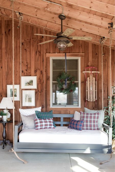 Christmas front porch with plaid pillows, Christmas tree and patio swing bed 

#LTKSeasonal #LTKCyberWeek #LTKHoliday