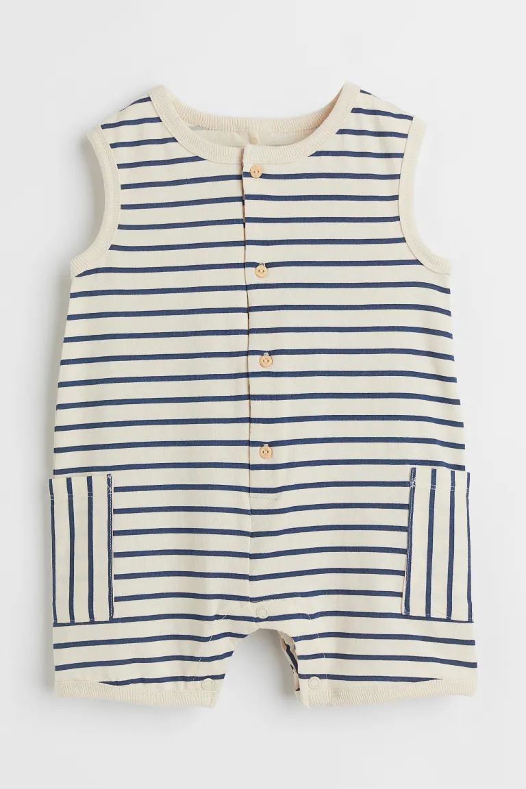 Sleeveless romper suit in soft, printed cotton jersey with buttons down the front, press-studs at... | H&M (US + CA)