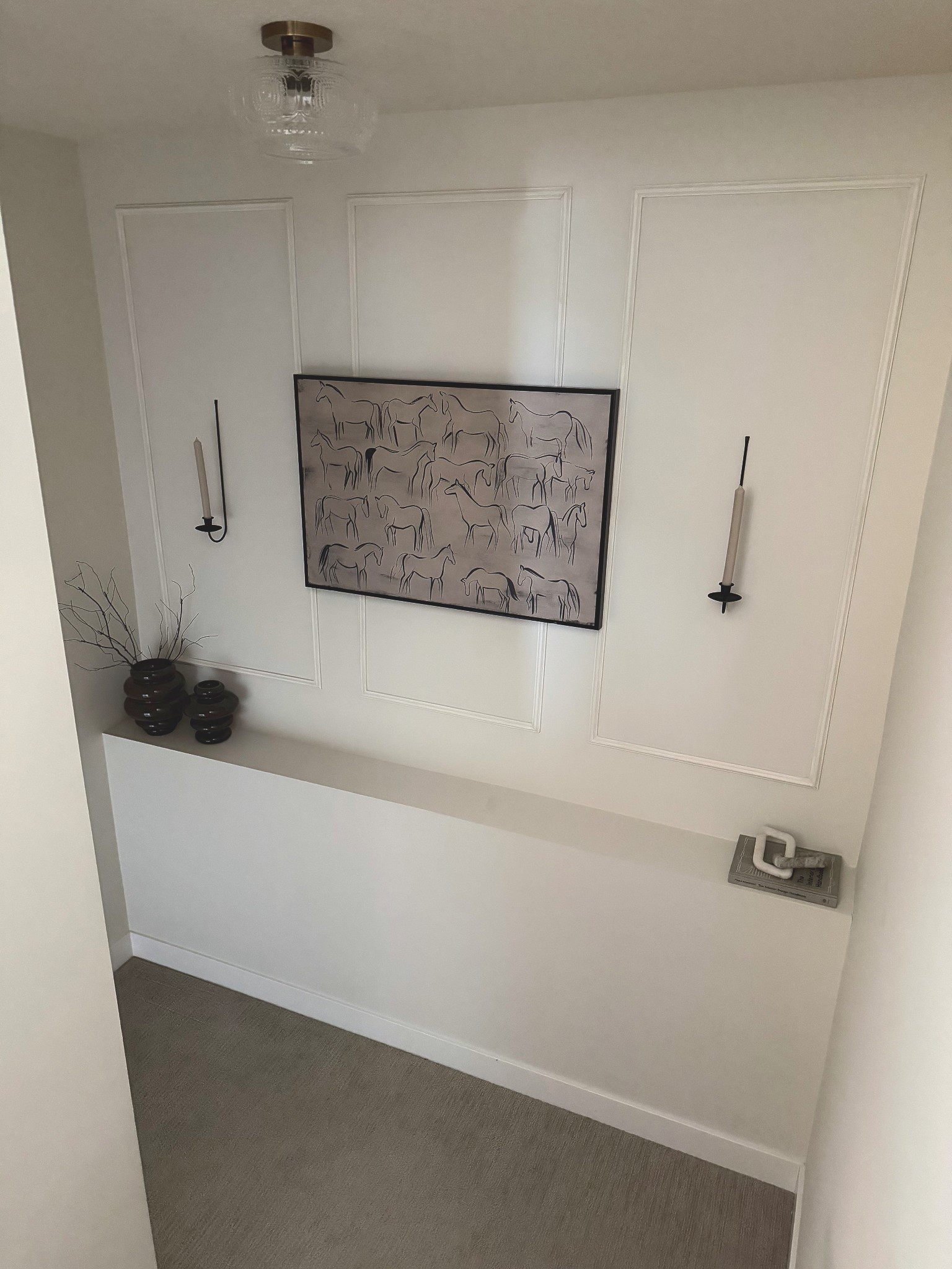 I’d like the art to be a little wider and might swap (love the art itself though and a good price)! But an easy and affordable upgrade to this wall that leads to our lower level!

#LTKHome