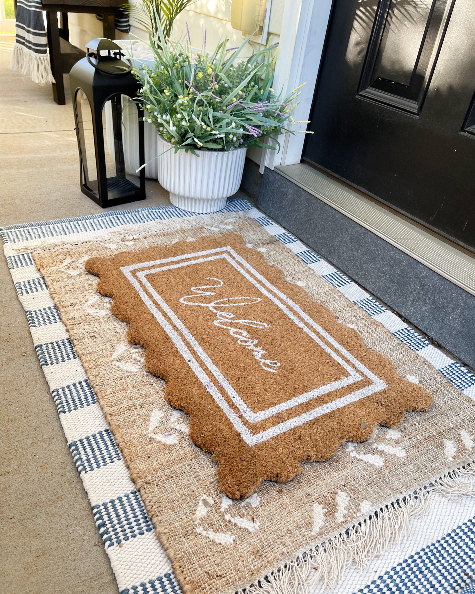 Outdoor welcome rug. Walmart scalloped welcome mat. Outdoor rug. Spring entryway. Front porch styling. Outdoor decor. Black lantern. Faux plants. Ribbed planter. 

#LTKxTarget 

#LTKhome #LTKsalealert 

#LTKSeasonal