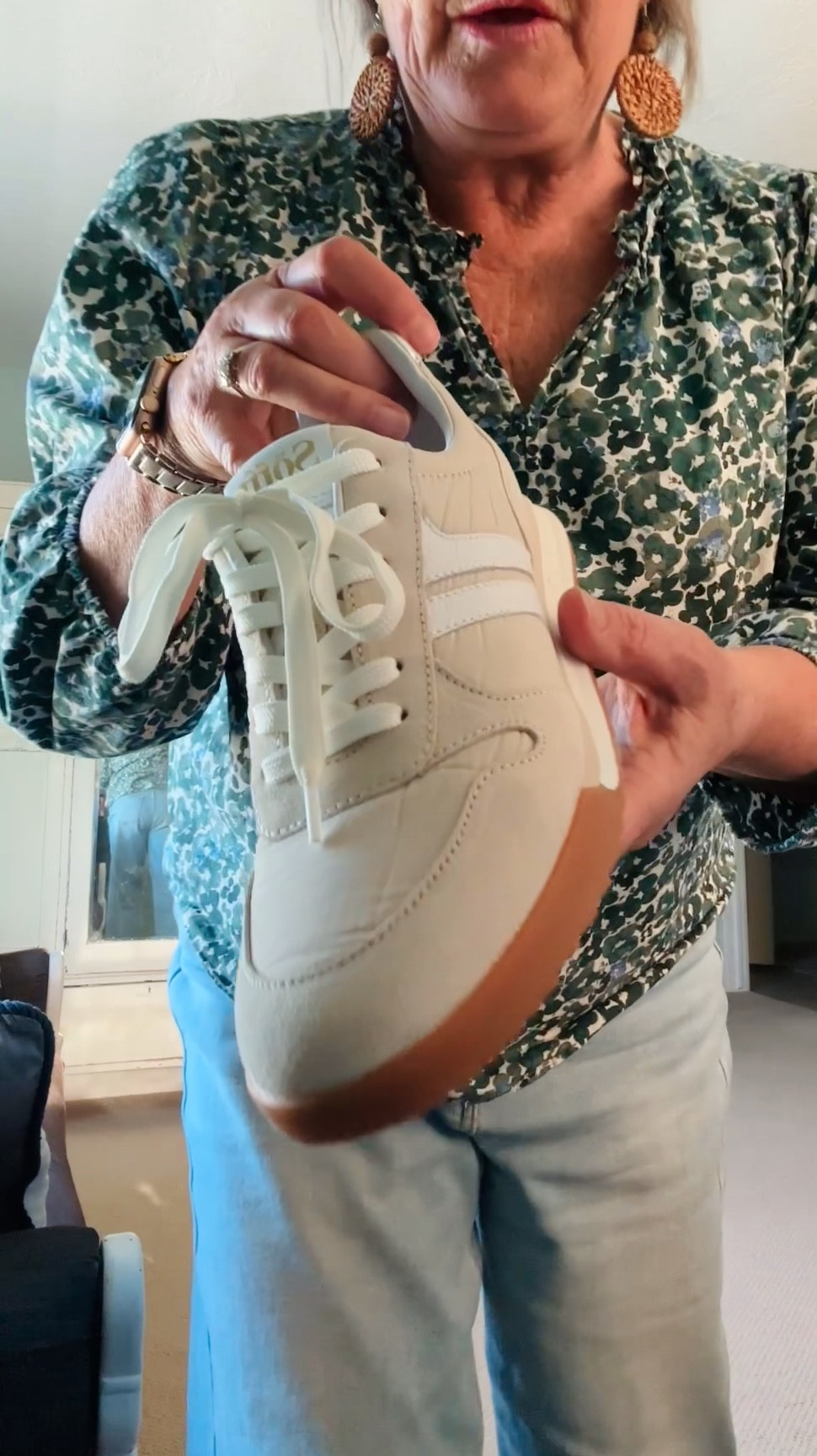 Sharing my #ootd light blue wide leg denim jeans, a fun v-neck blue and green floral top with elastic at bottom of sleeves and super comfortable cream and white sneakers from @coldwatercreek 

#LTKdayinmylife #LTKMidsize