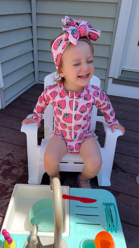Toddler girl swim ; strawberry swimsuit ; toddler outdoor toys ; toddler play sink ; must have toy ; first birthday gift idea ; toddler gift idea 

Strawberry ruffle swimsuit & swim bow @tyednknots - code JULES

#LTKSeasonal #LTKBaby #LTKKids