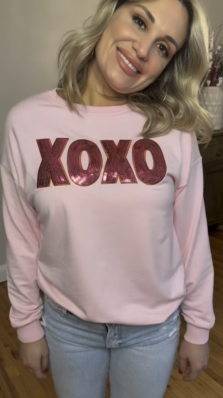 Love this adorable Valentine’s Day crew neck sweatshirt you can dress up or down! 

Pink sweatshirt: Medium 
Jeans: size down 4
Skirt: medium 