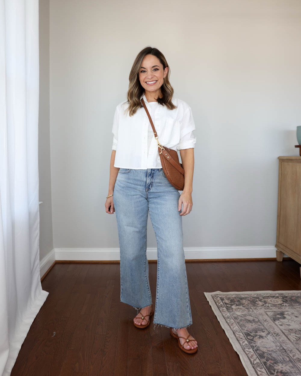 Under $25 cropped button-down top styled four ways.

White button down (Old Navy): petite xs 

Outfit 1: 
Jeans (JC Factory): 24 standard - 26.5” inseam. These also come in petite for a shorter option. 
White tank top (Quince): xs
Sandals (Dolce Vita): true to size

Outfit 2:
Linen shorts (J.Crew): xxs - unlined 
White tank top (Quince): xs
Sandals (Dolce Vita): true to size

Outfit 3:
Linen blend pants (Abercrombie): xxs short - size up if in between sizes, they shrink in the wash. 28” inseam in short 
White tank top (Quince): xs
Straw bag (Sezane)
Sandals (Dolce Vita): true to size  

Outfit 4:
Dad shorts (Abercrombie): 25 sized up
Sandals (Dolce Vita): true to size

My measurements for reference: I’m 4’10” and 105lbs. My bust, waist, and hip measurement is 32”, 24”, and 36”.

#LTKSeasonal #LTKootd #LTKPetite