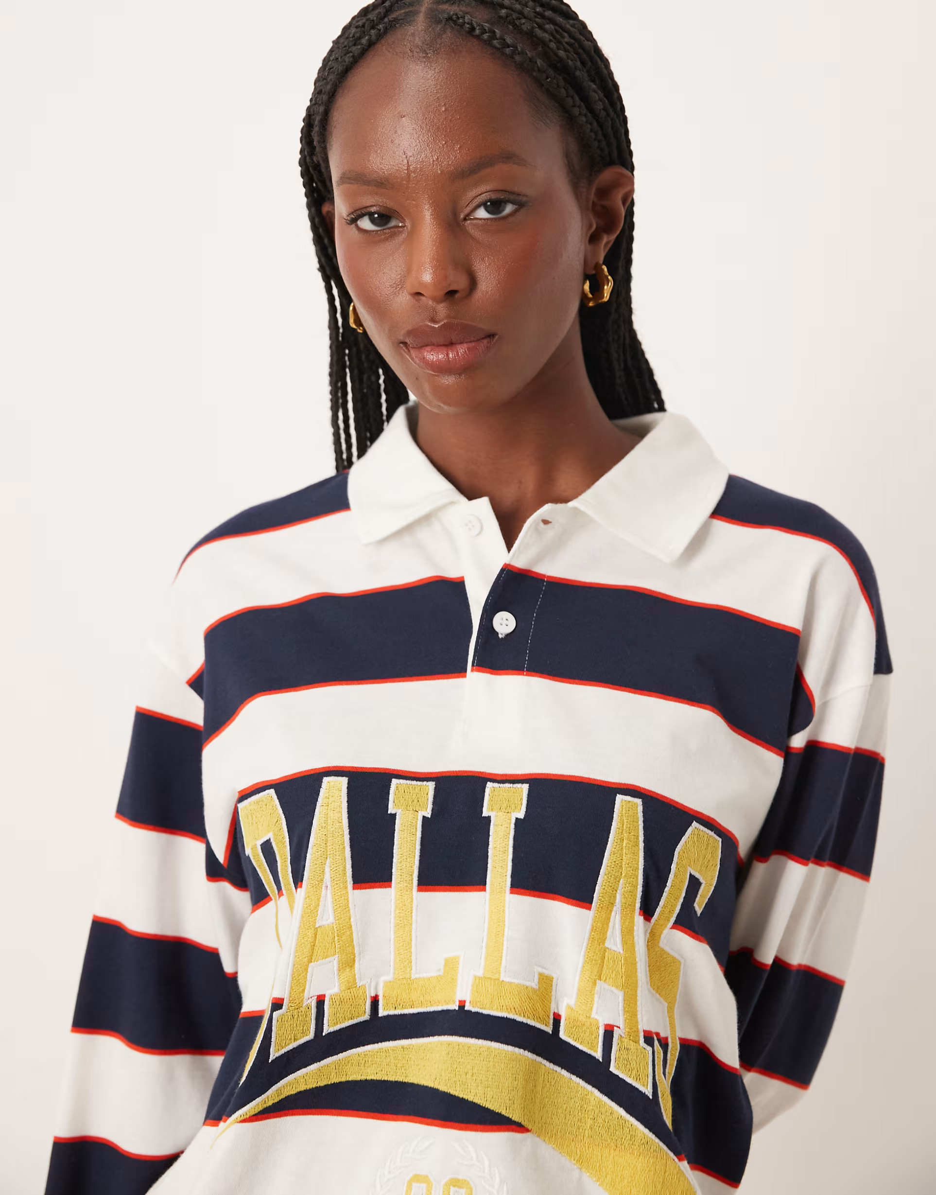 ASOS DESIGN oversized rugby polo top with dallas graphic in black stripe | ASOS (Global)
