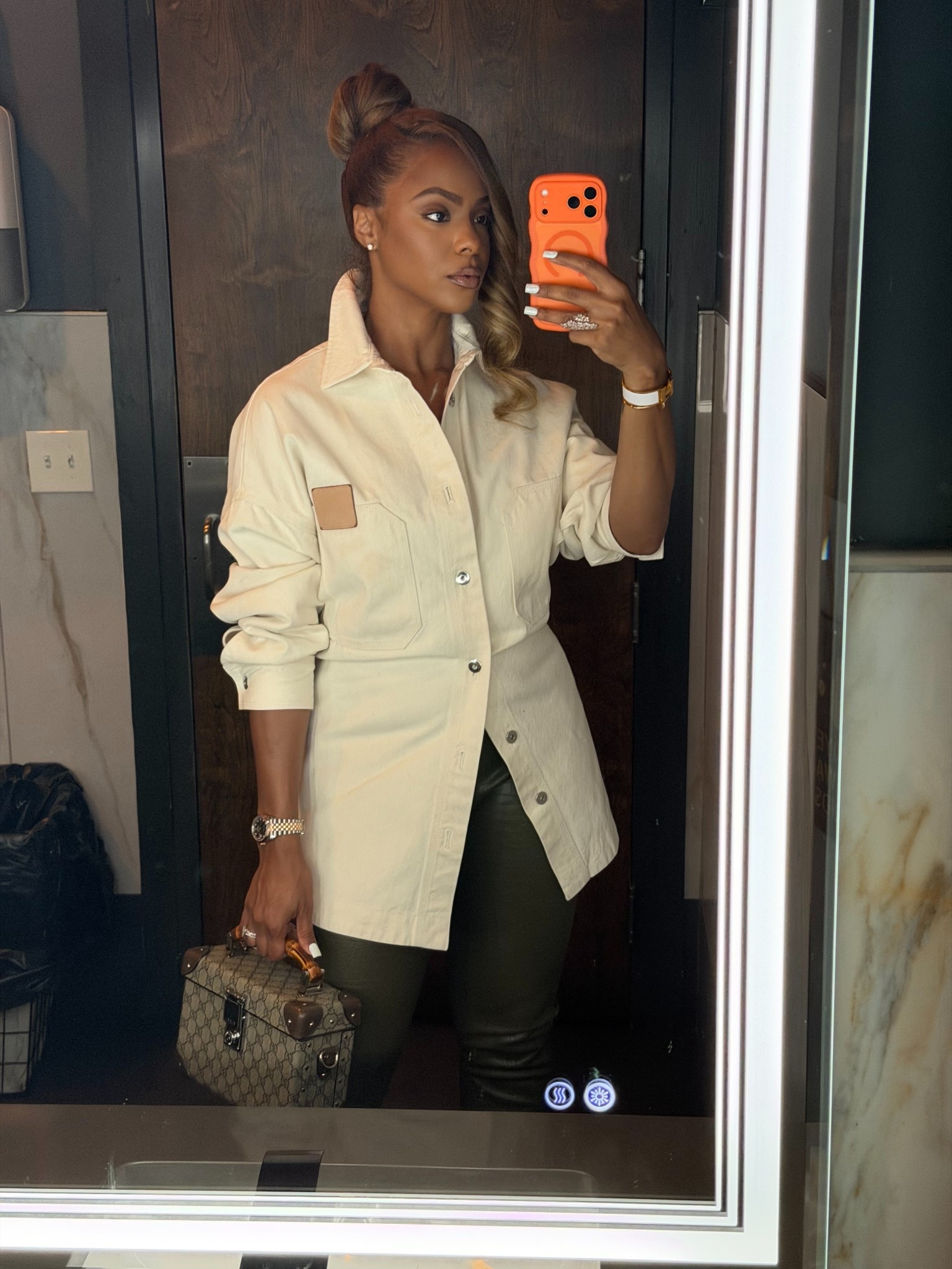 Cinched the waist of this oversized top by adding a brooch to the back!